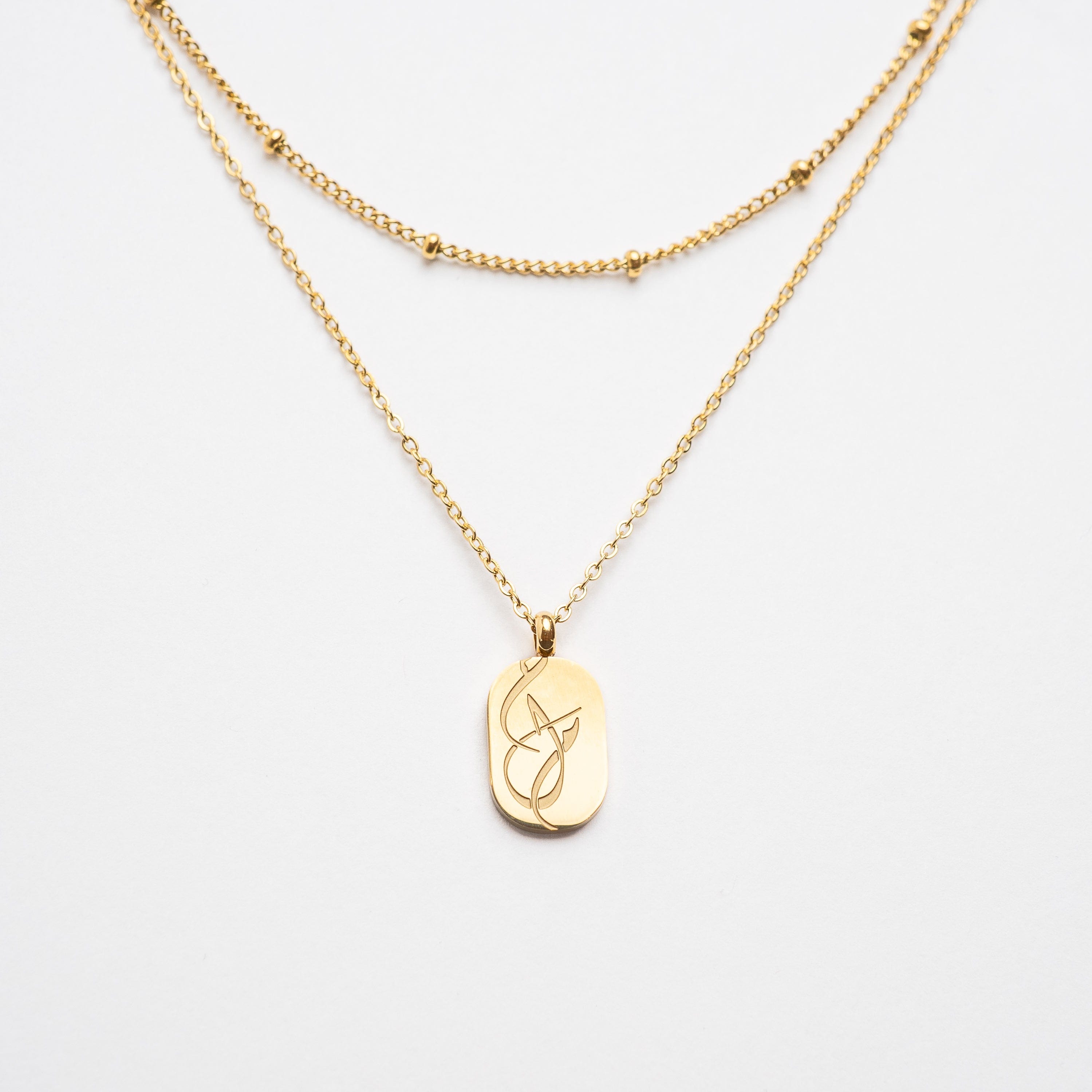 Dreamy Gold Layering Necklace Set displayed on a mannequin, showcasing adjustable lengths.