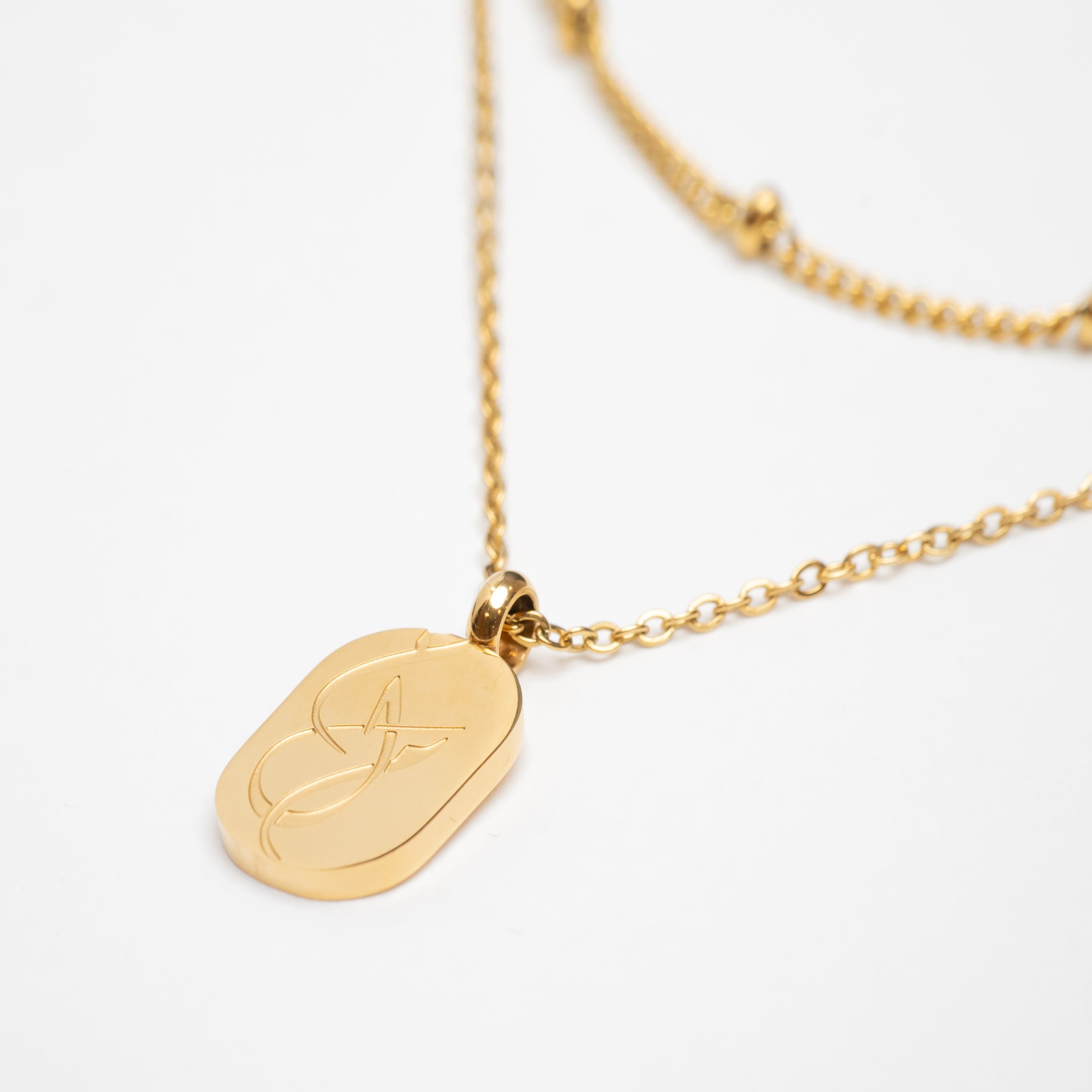 The necklace set beautifully arranged in a velvet drawstring pouch, emphasizing its gift-ready packaging.