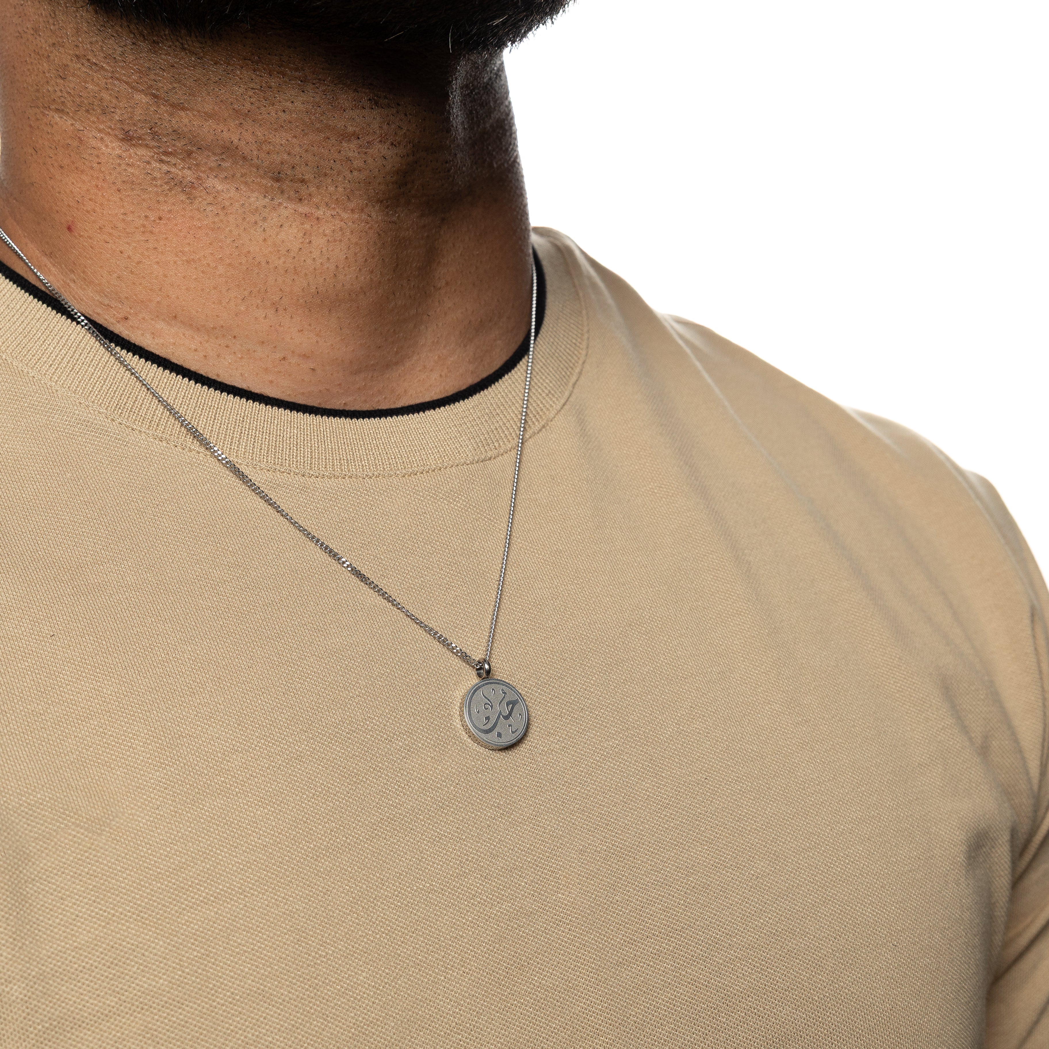 Mens jewelry featuring the Arabic calligraphy love necklace worn on a model, highlighting its appeal.