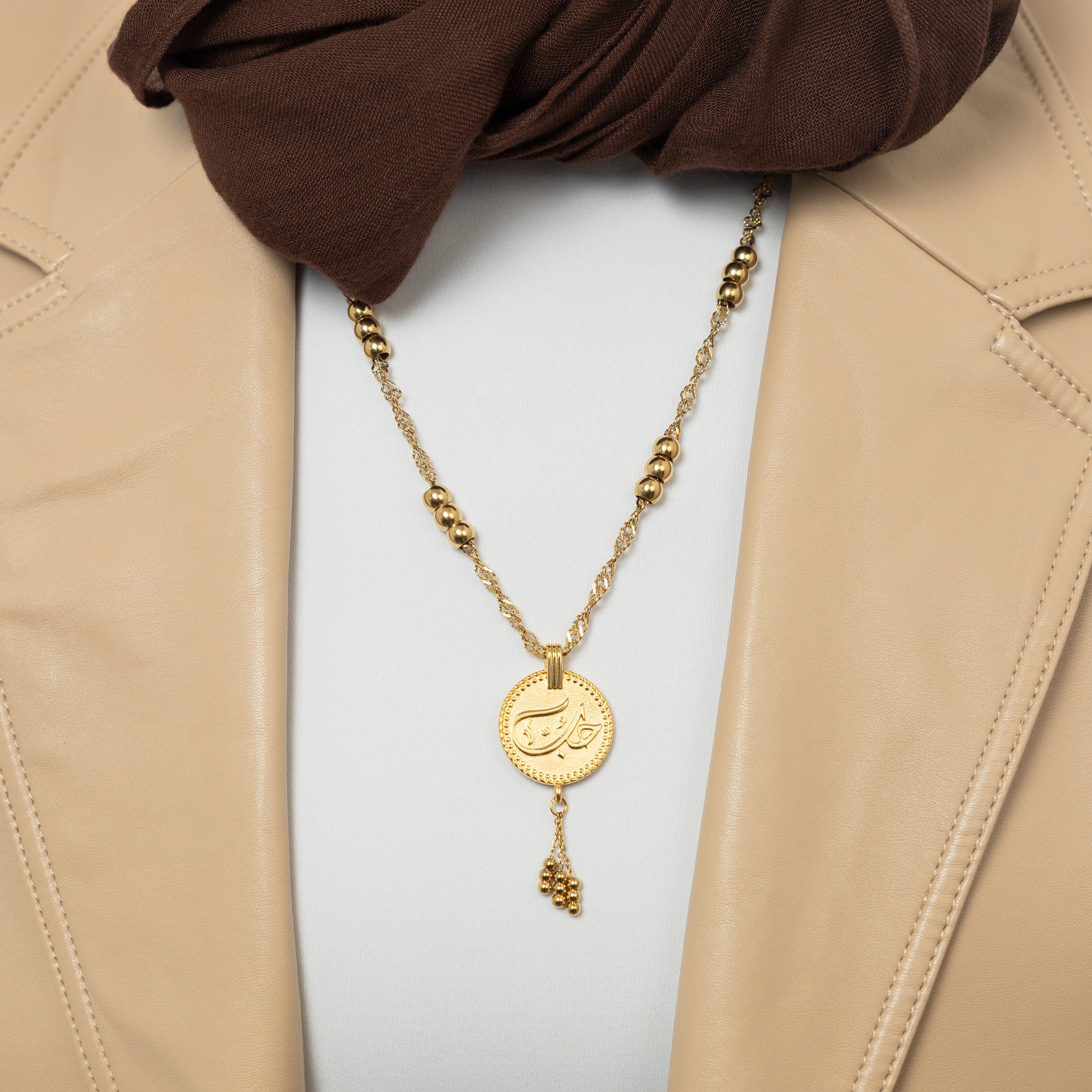Close-up of the Eternal Love Vintage Coin Necklace showcasing intricate Arabic engraving.