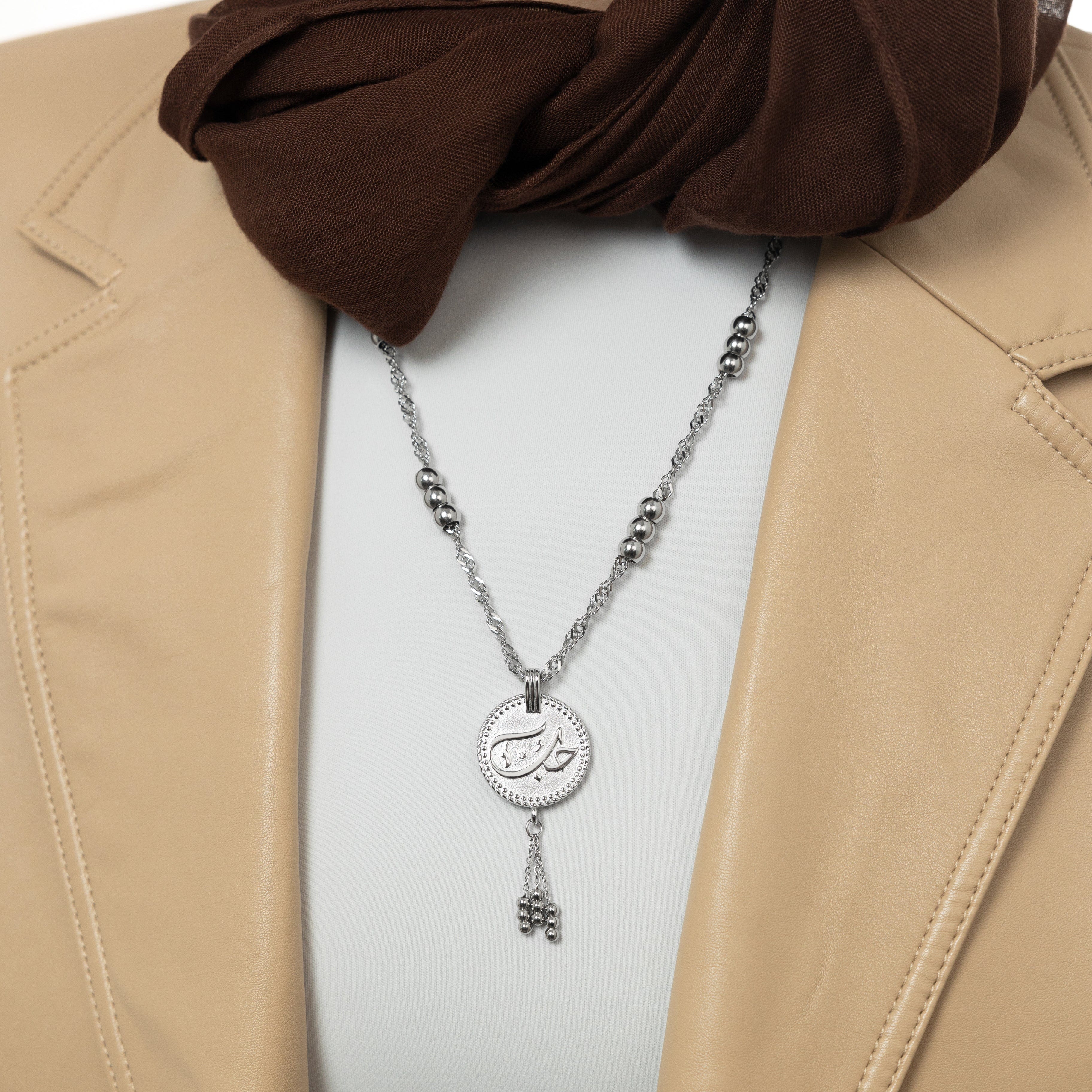 Close-up of the Eternal Love Vintage Coin Necklace showcasing intricate Arabic engraving.