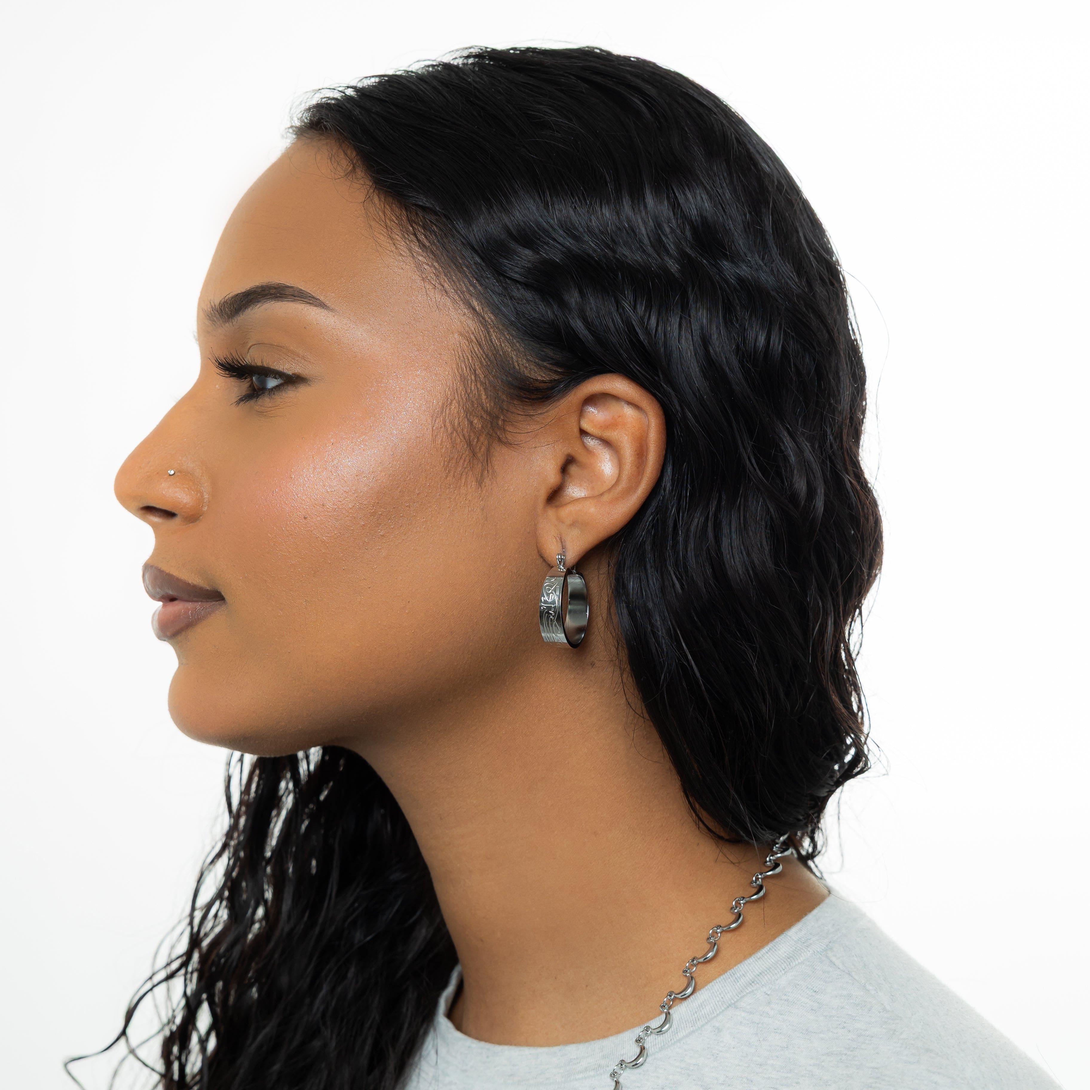 Close-up of Self-Love Hoop Earrings showcasing the Arabic inscription.