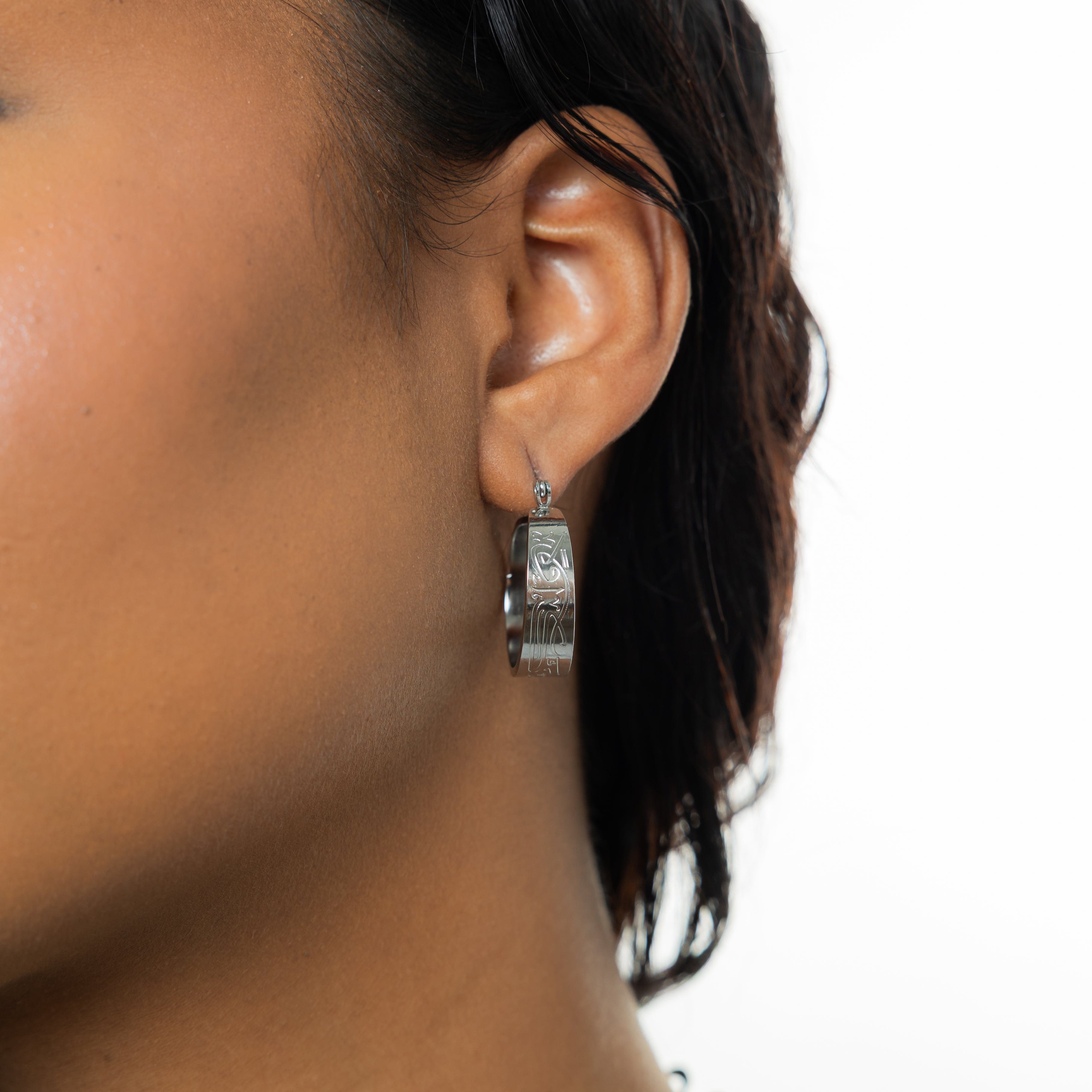 Elegant Self-Love Hoop Earrings displayed in a velvet pouch.