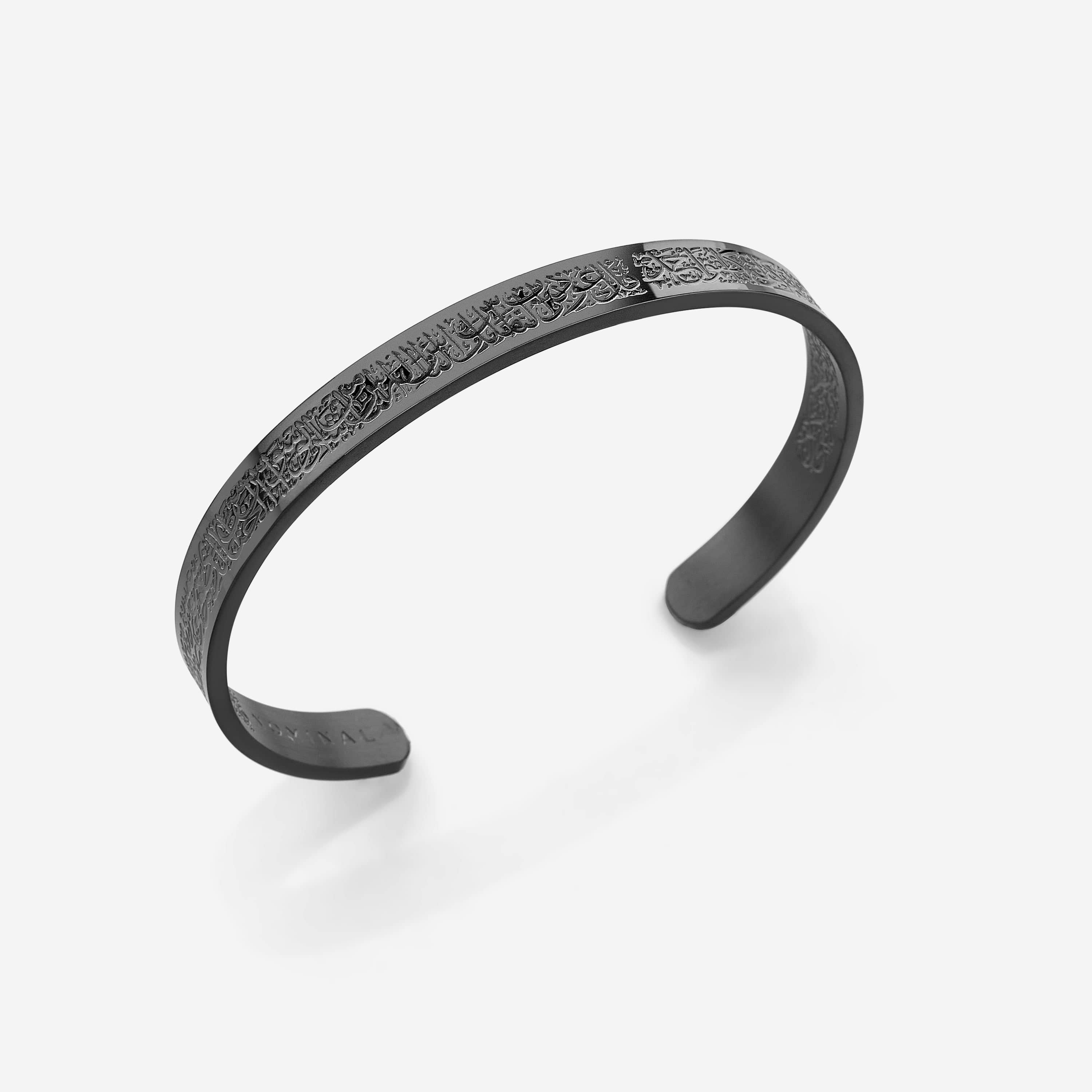 Elegant engraved cuff for men showcasing intricate designs from different angles.