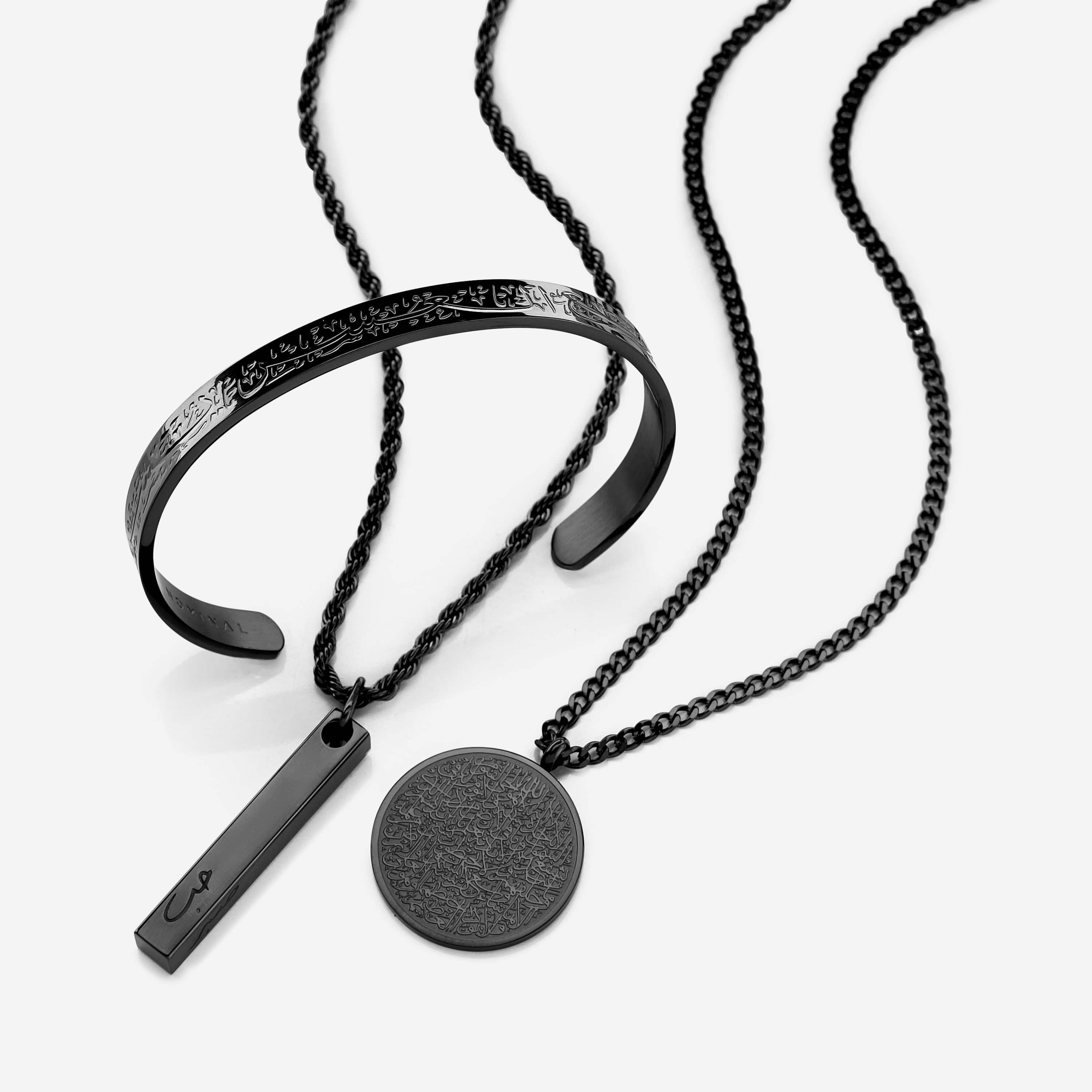 Mens 3D Bar Necklace photographed flat on a wooden surface, highlighting all four engraved sides