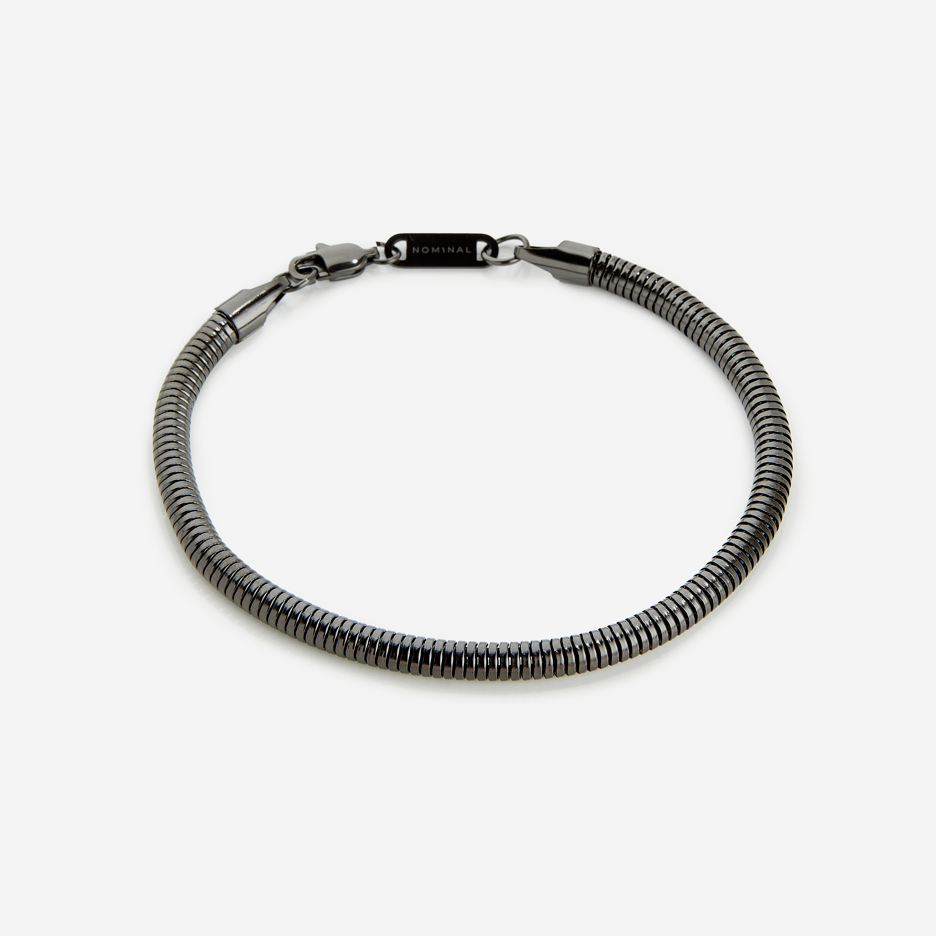 Product packaging of the Harmony stainless steel bracelet, including the velvet pouch and warranty details.