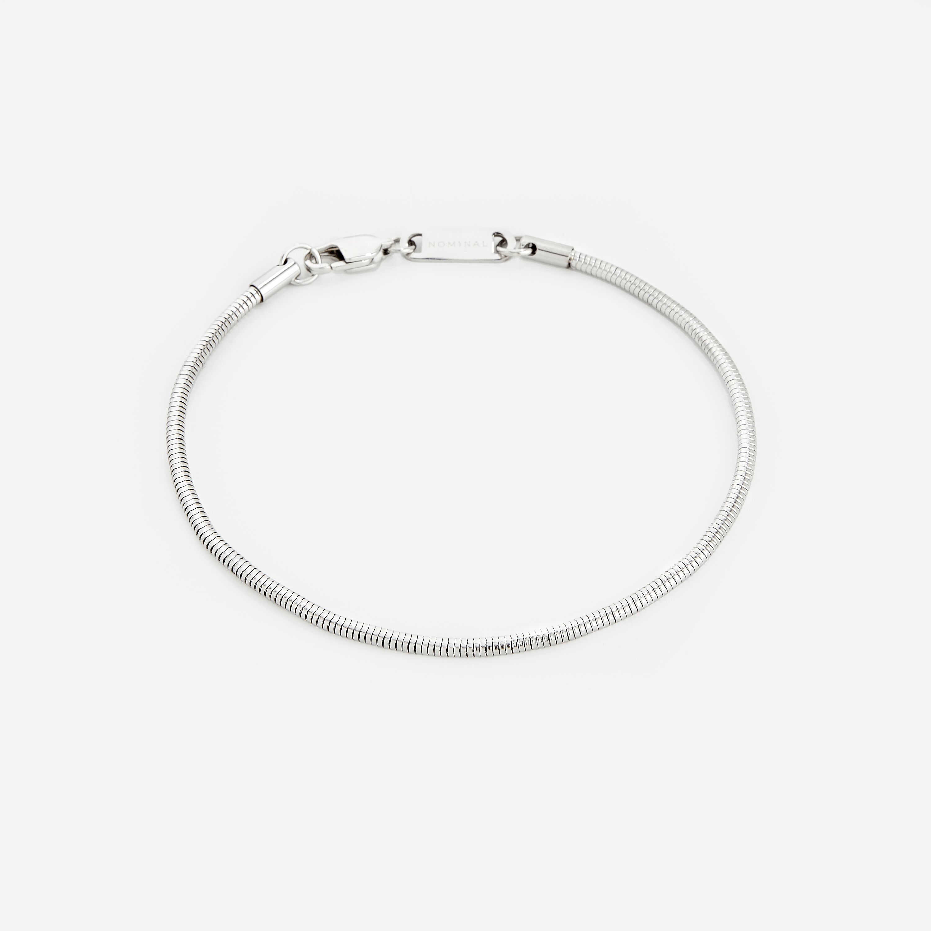 Lifestyle image of a man wearing the Harmony stainless steel bracelet, adding sophistication to his outfit.
