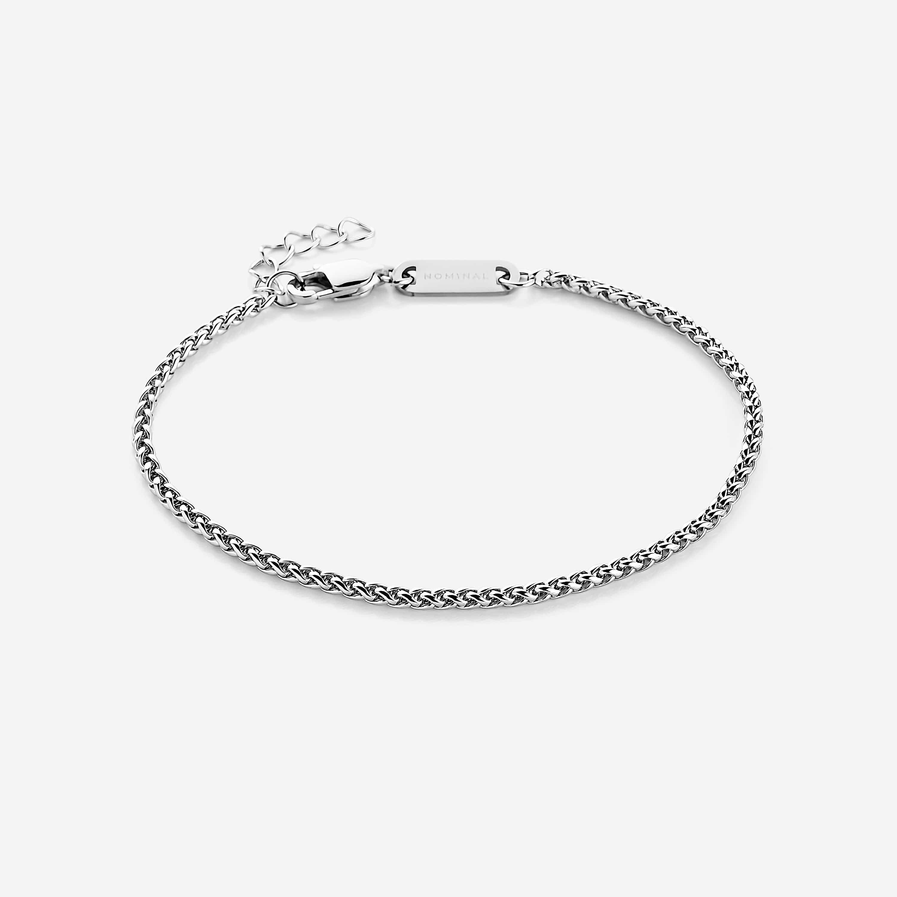Close-up of the sleek micro wheat chain bracelet highlighting its 2MM thickness.