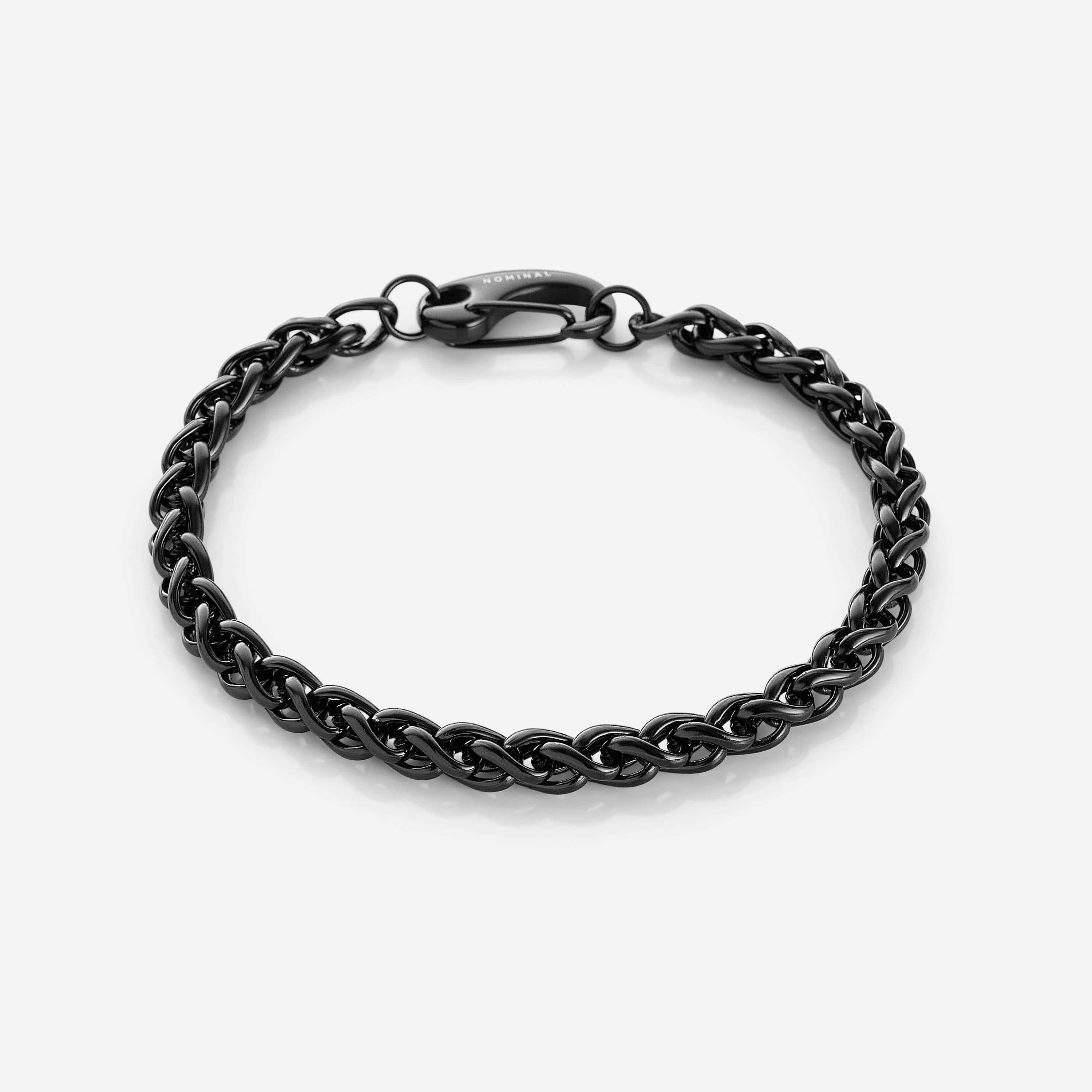 Stylish man wearing the wheat chain bracelet, highlighting its versatility for any occasion.