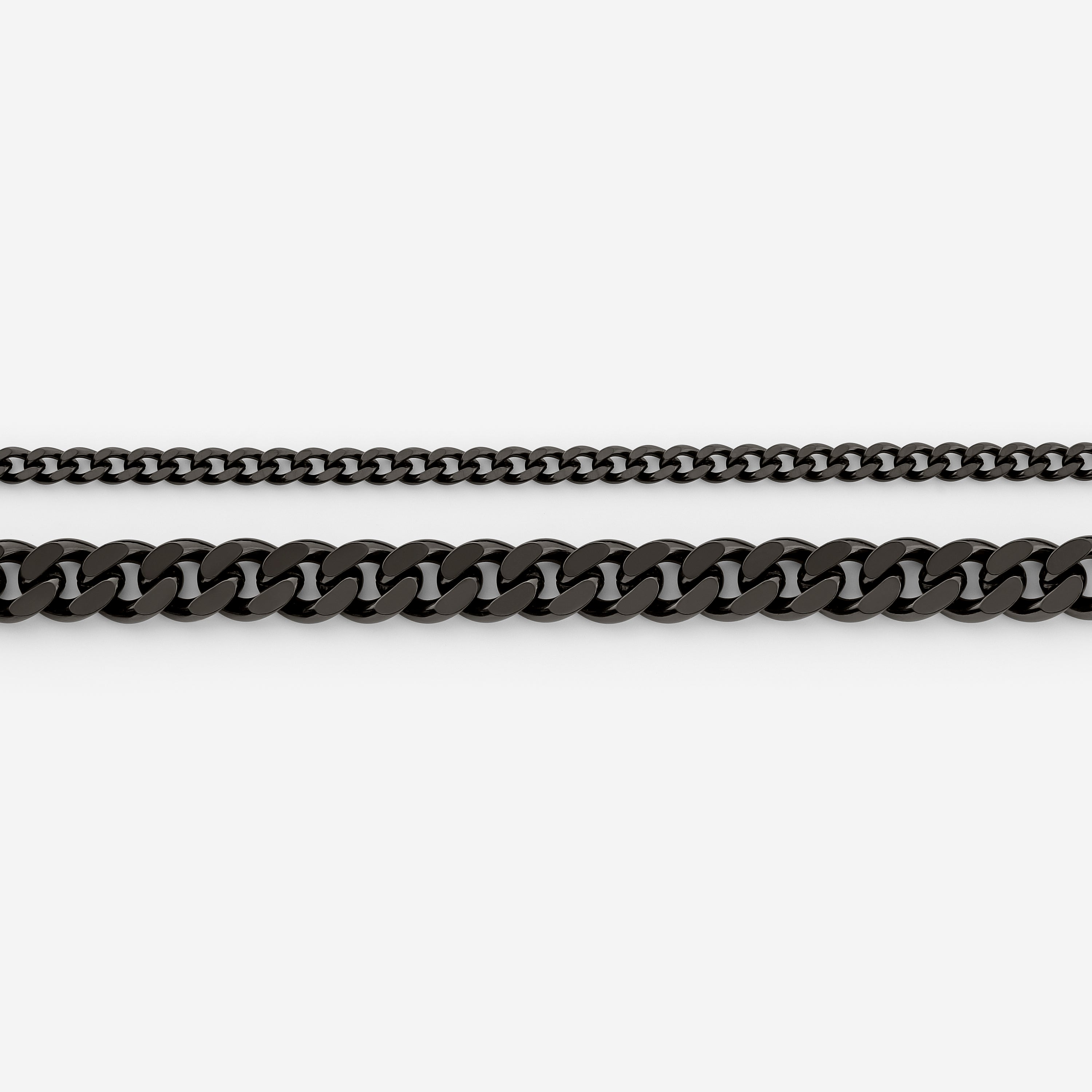 Curb chain bracelet placed in a velvet drawstring pouch, emphasizing its packaging.