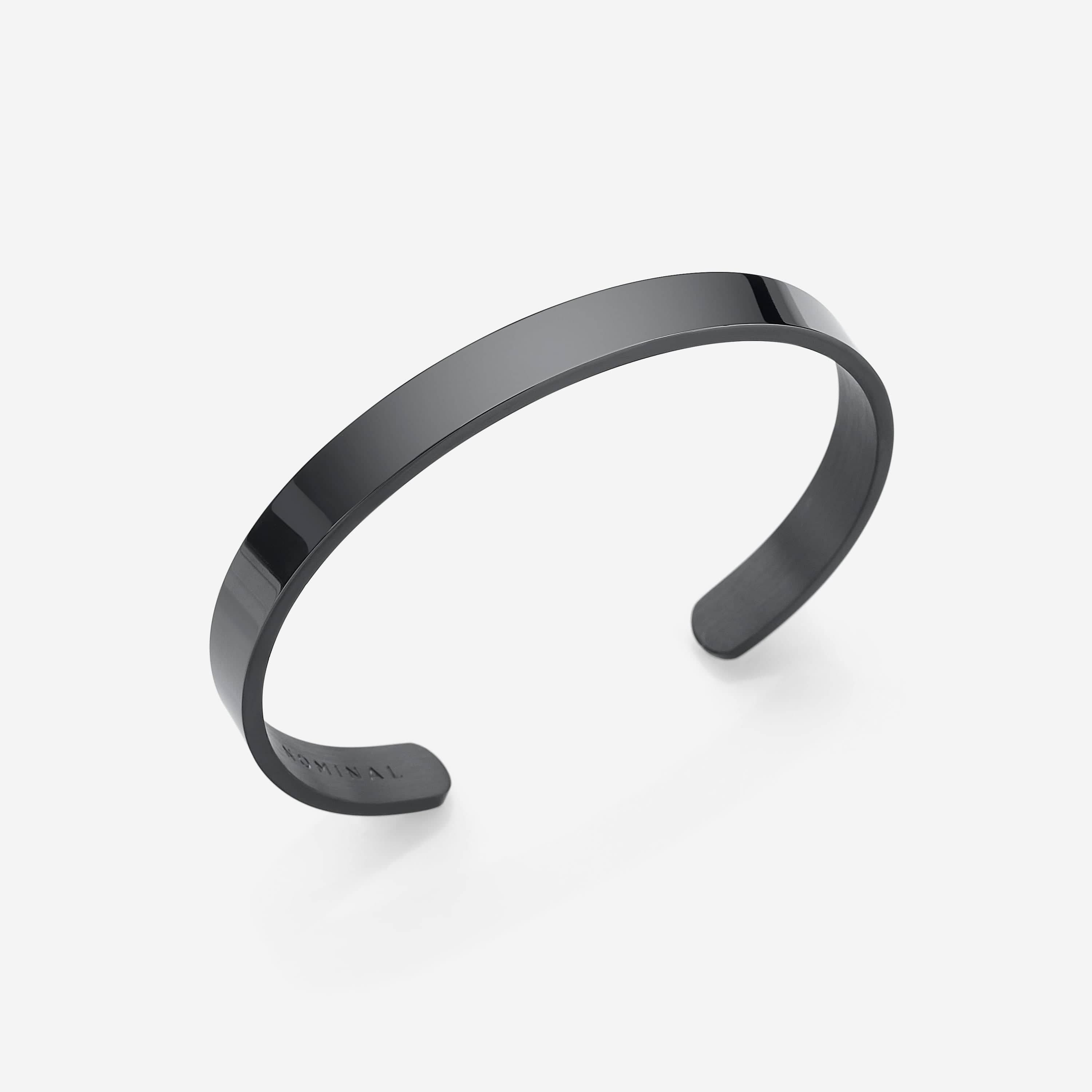 Front view of the sleek minimalist stainless steel cuff bracelet, showcasing its adjustable feature.
