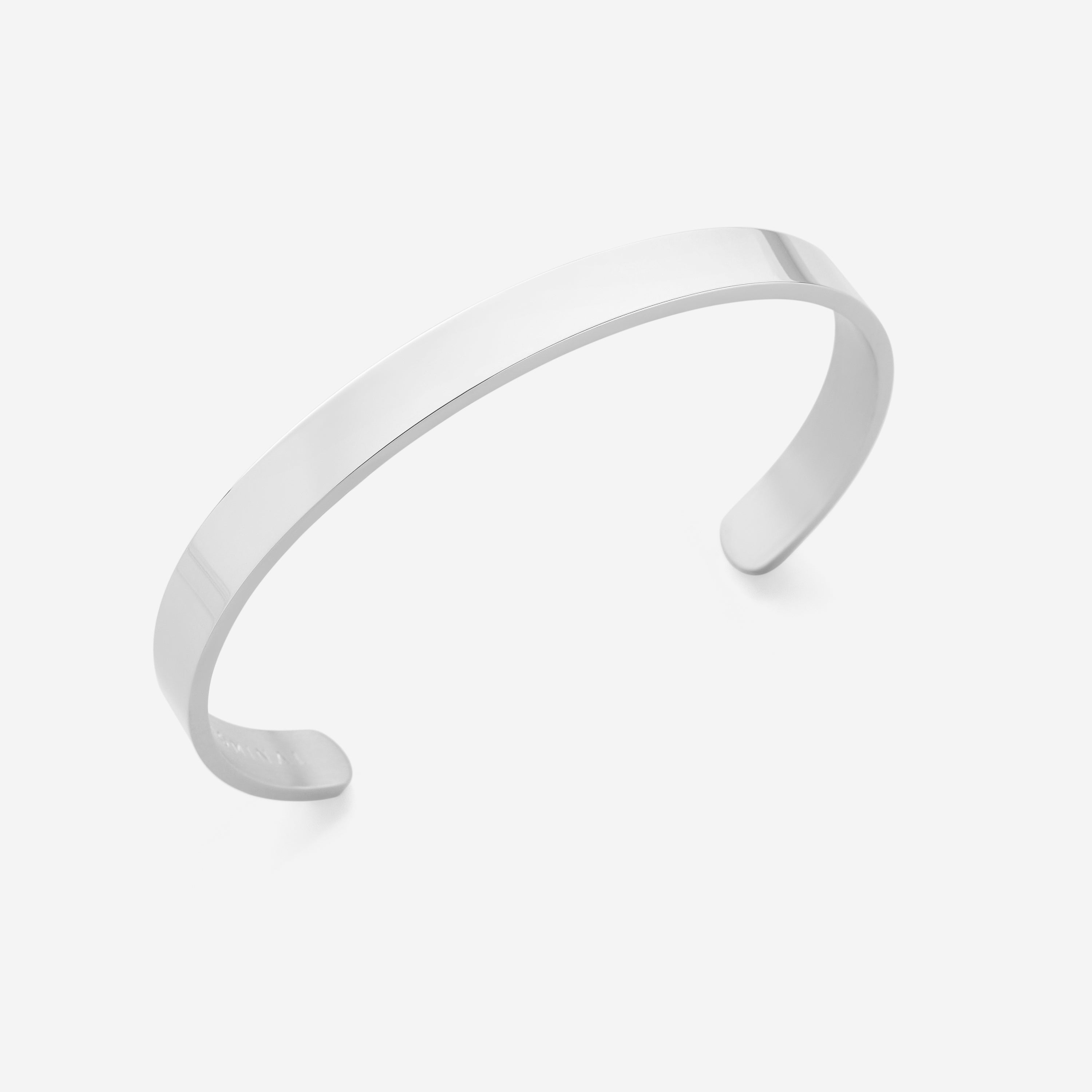 Front view of the sleek minimalist stainless steel cuff bracelet, showcasing its adjustable feature.