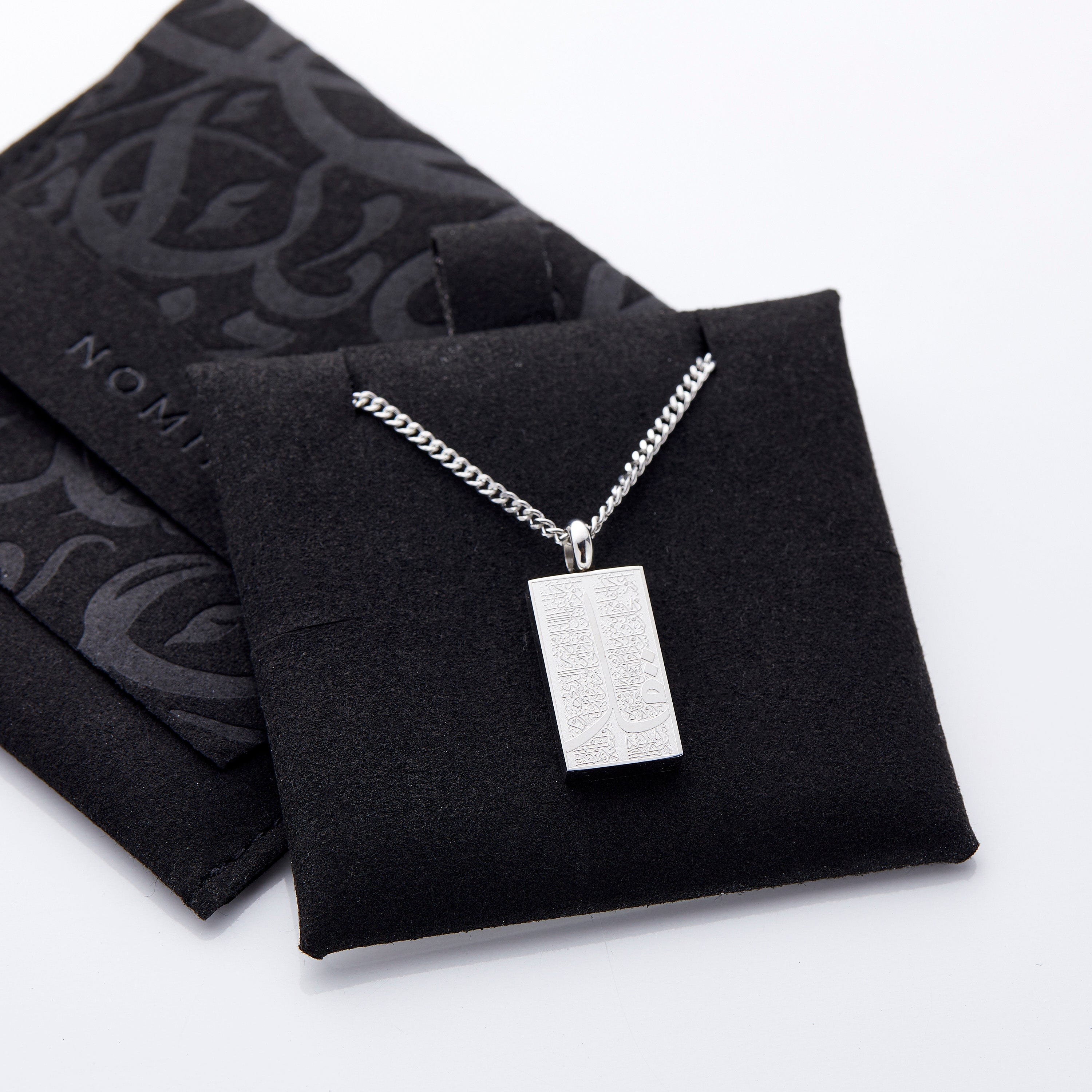 Display of the Four Qul necklace in a velvet pouch, emphasizing its gift-ready presentation.