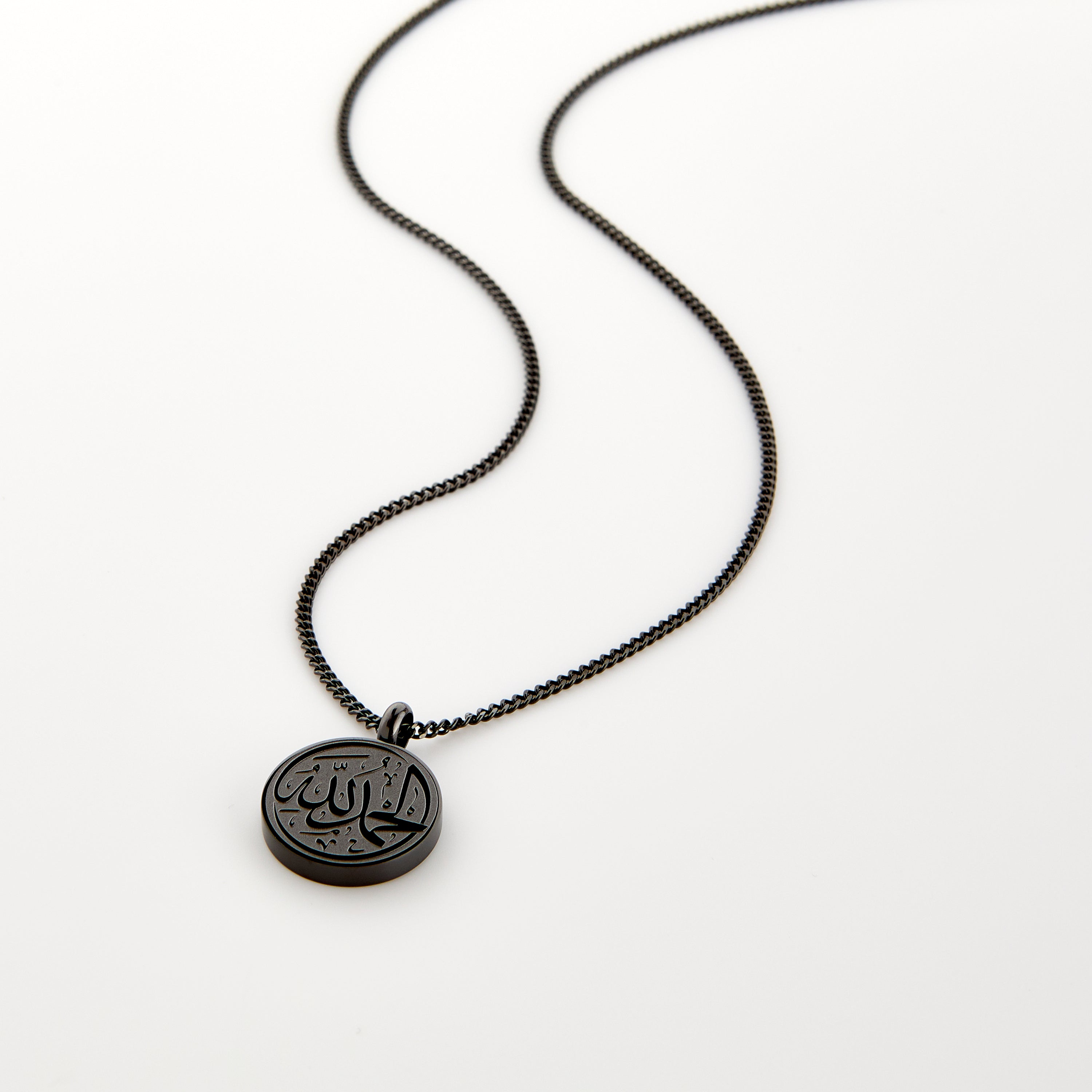 Side view of the stainless steel token necklace, highlighting its durable chain and pendant size.