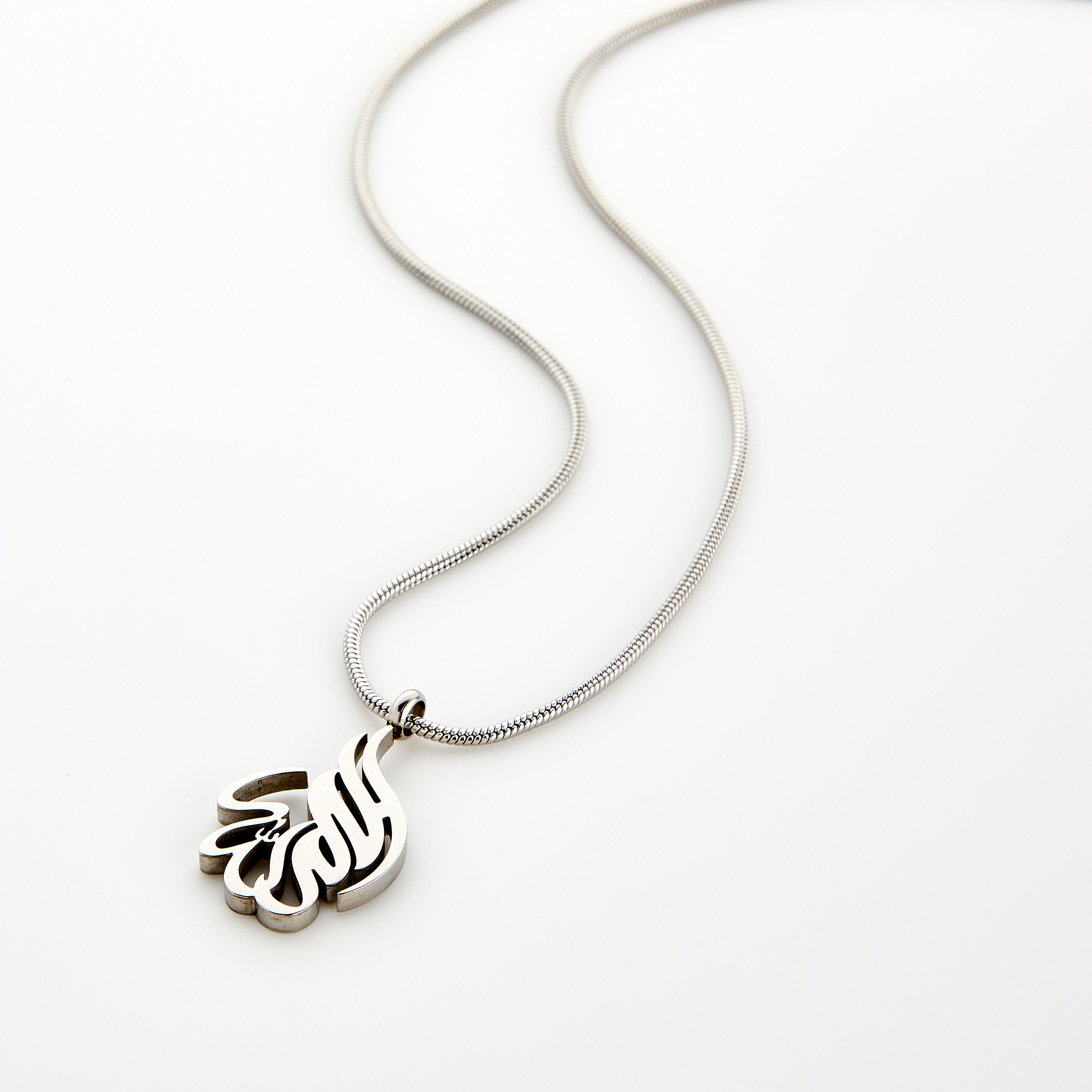 Front view of the Alhamdulillah calligraphy necklace on a black background, showcasing its intricate design.