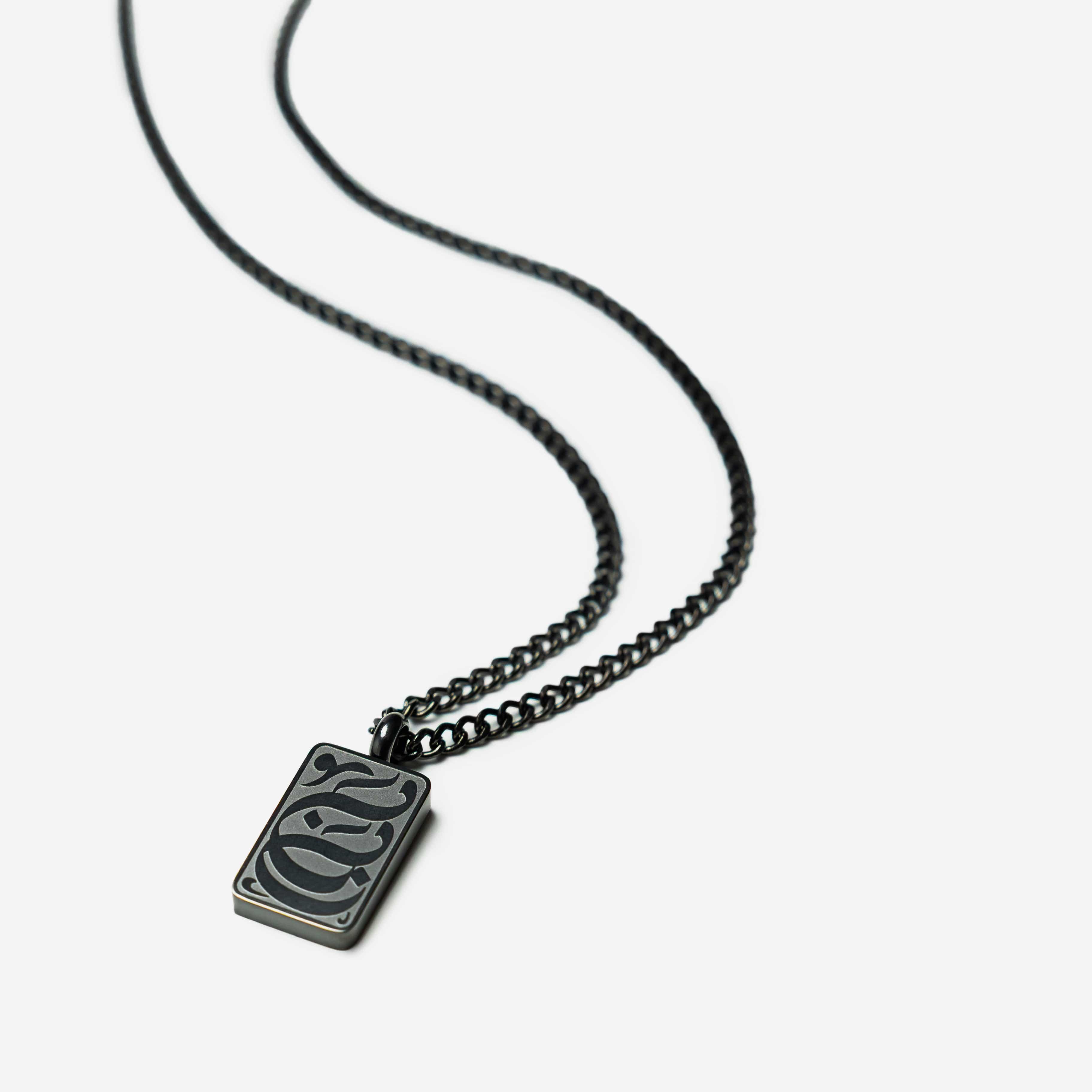 Baba tag necklace displayed in a velvet pouch, perfect for gifting.