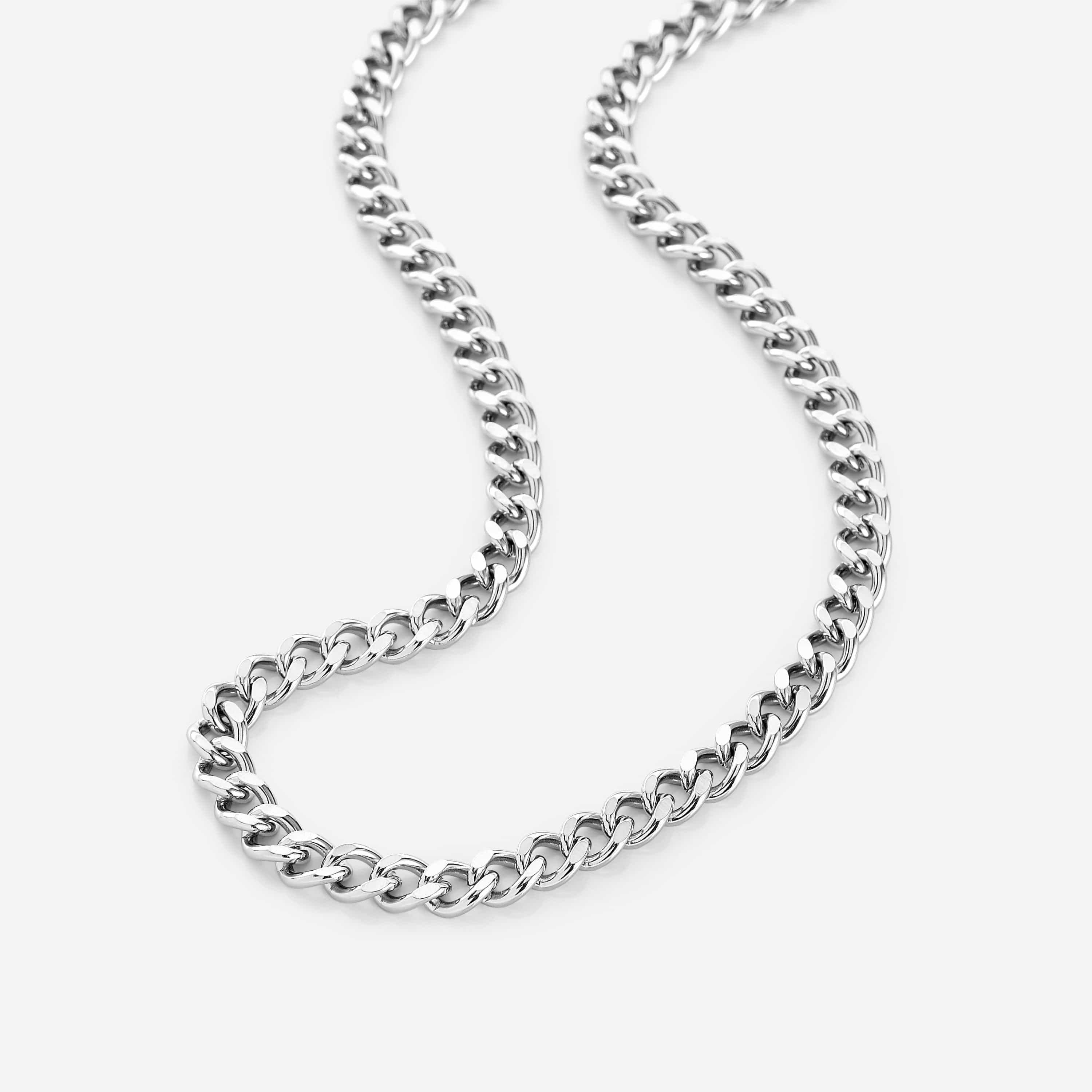 Close-up of the LegacyLink™ stainless steel Cuban chain necklace showing 7mm thick links in natural light.