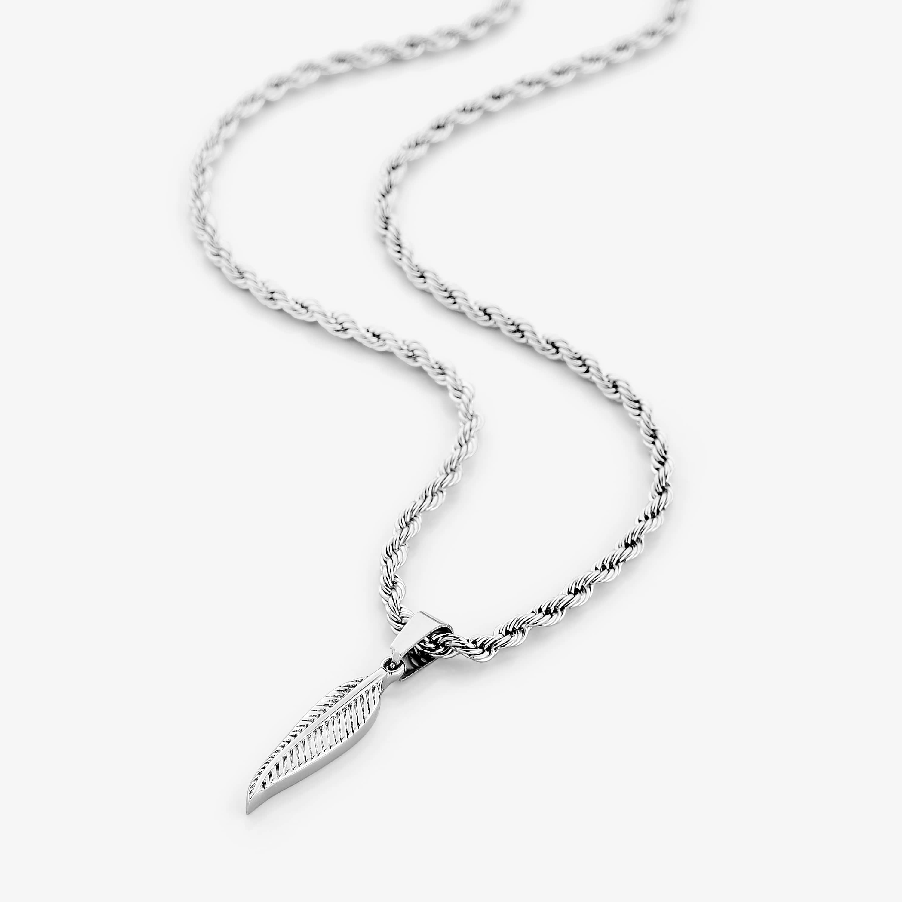 Close-up of the elegant stainless steel feather necklace showcasing its intricate design and shine.