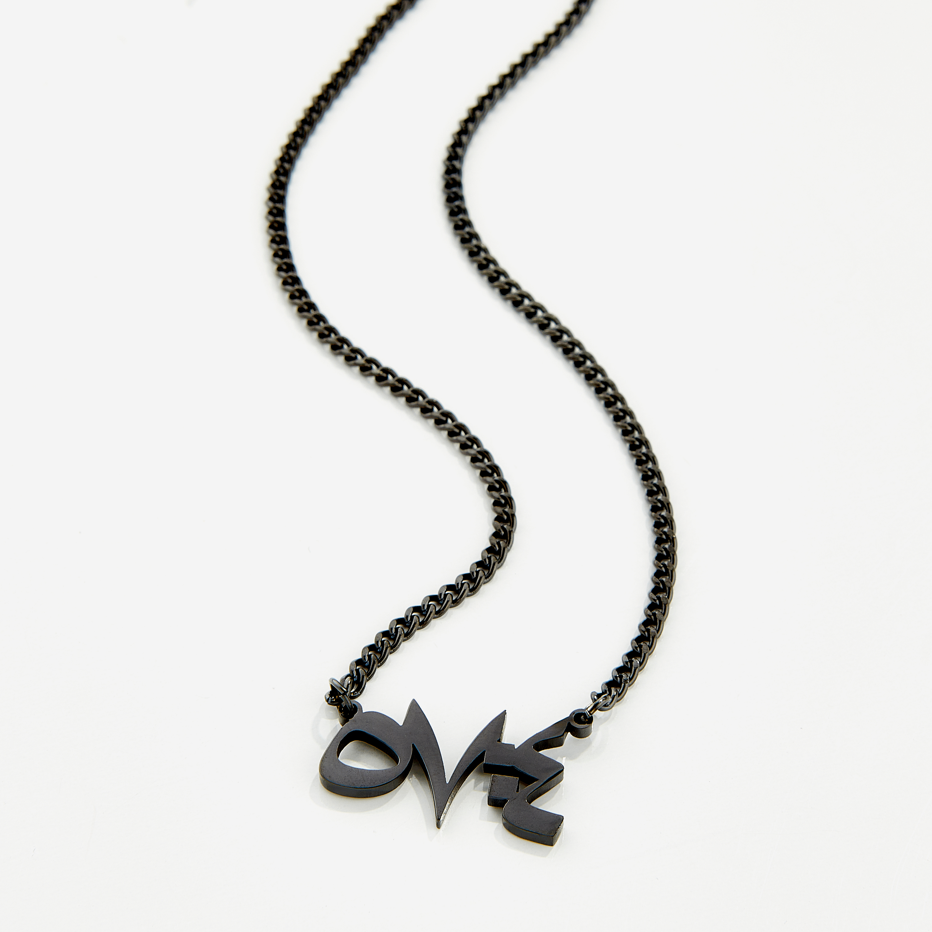 Velvet pouch containing the best stainless steel religious necklace, perfect for gifting.