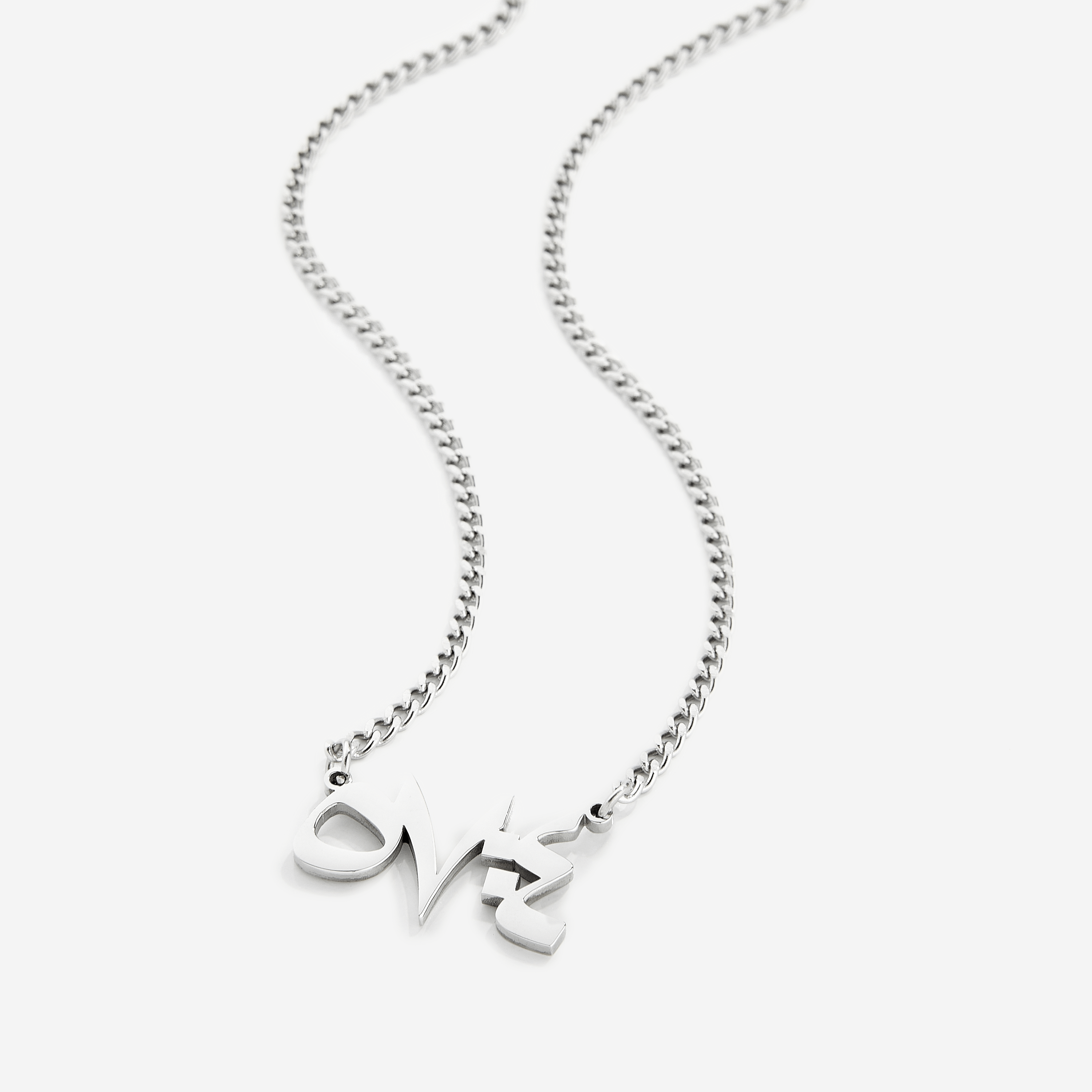 Close-up of Arabic calligraphy pendant with Quran verse for men, highlighting the craftsmanship.
