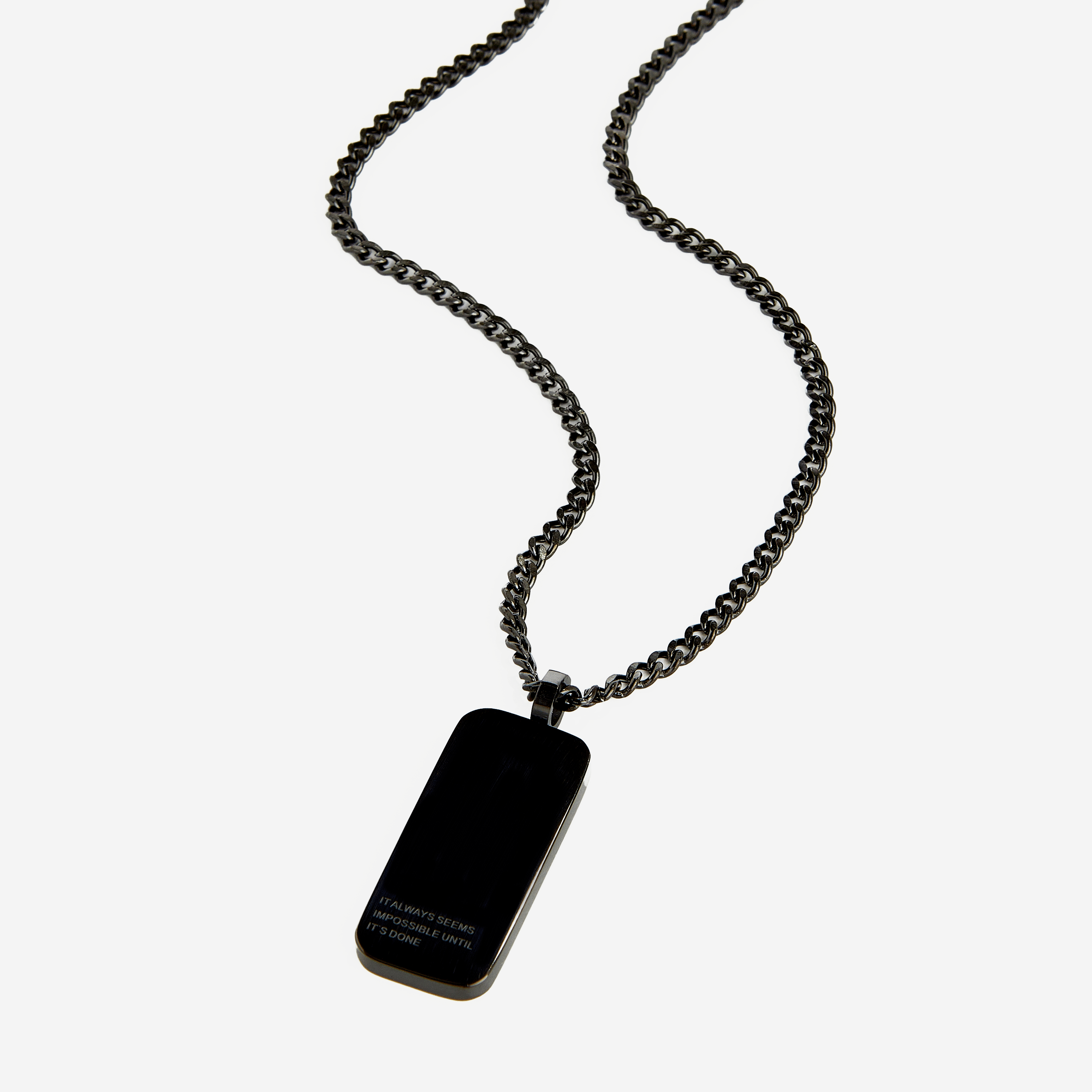 Side view of mens jewelry necklace worn over a white t-shirt