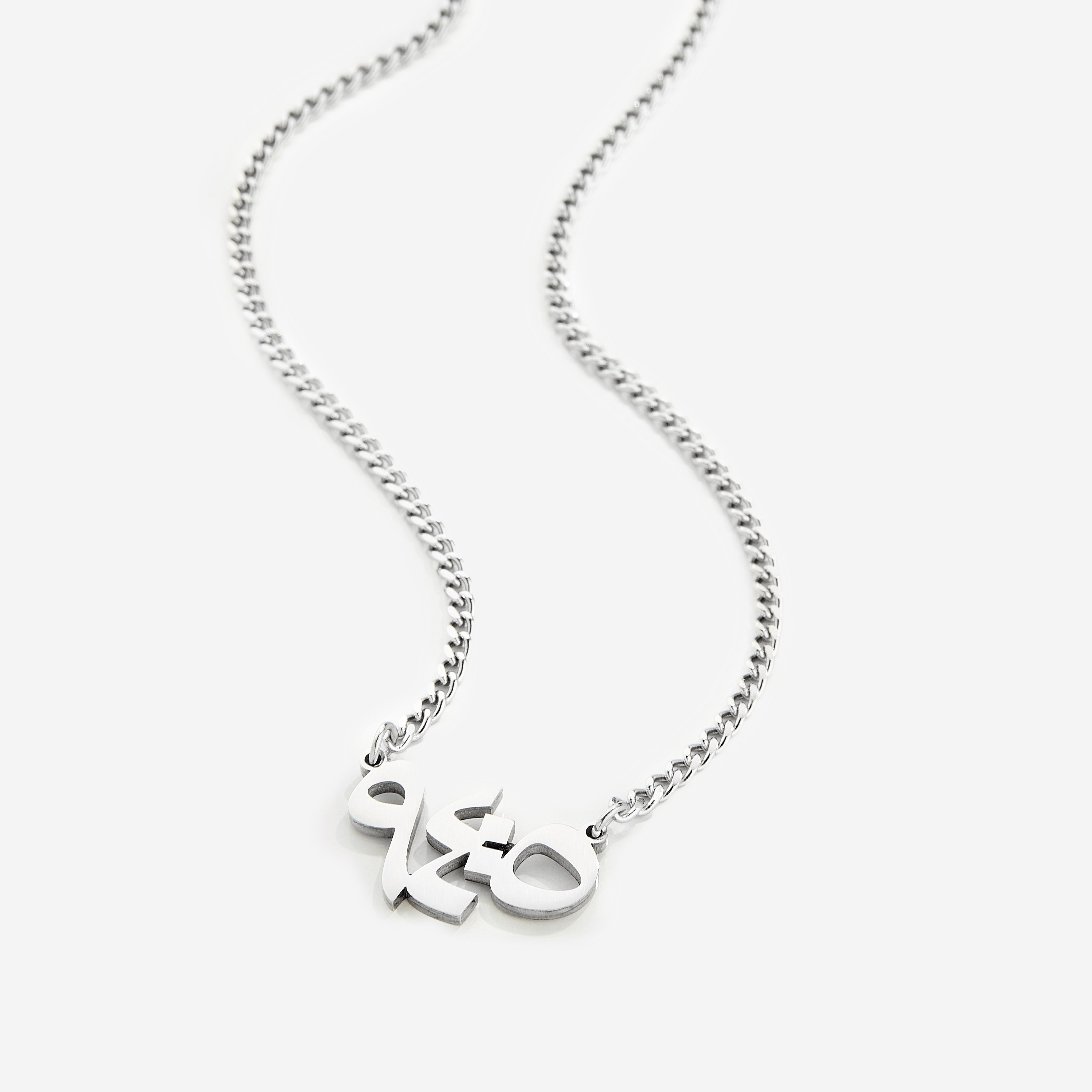 Men's stainless steel verse pendant with Arabic calligraphy showcasing 'With Hardship Comes Ease'.