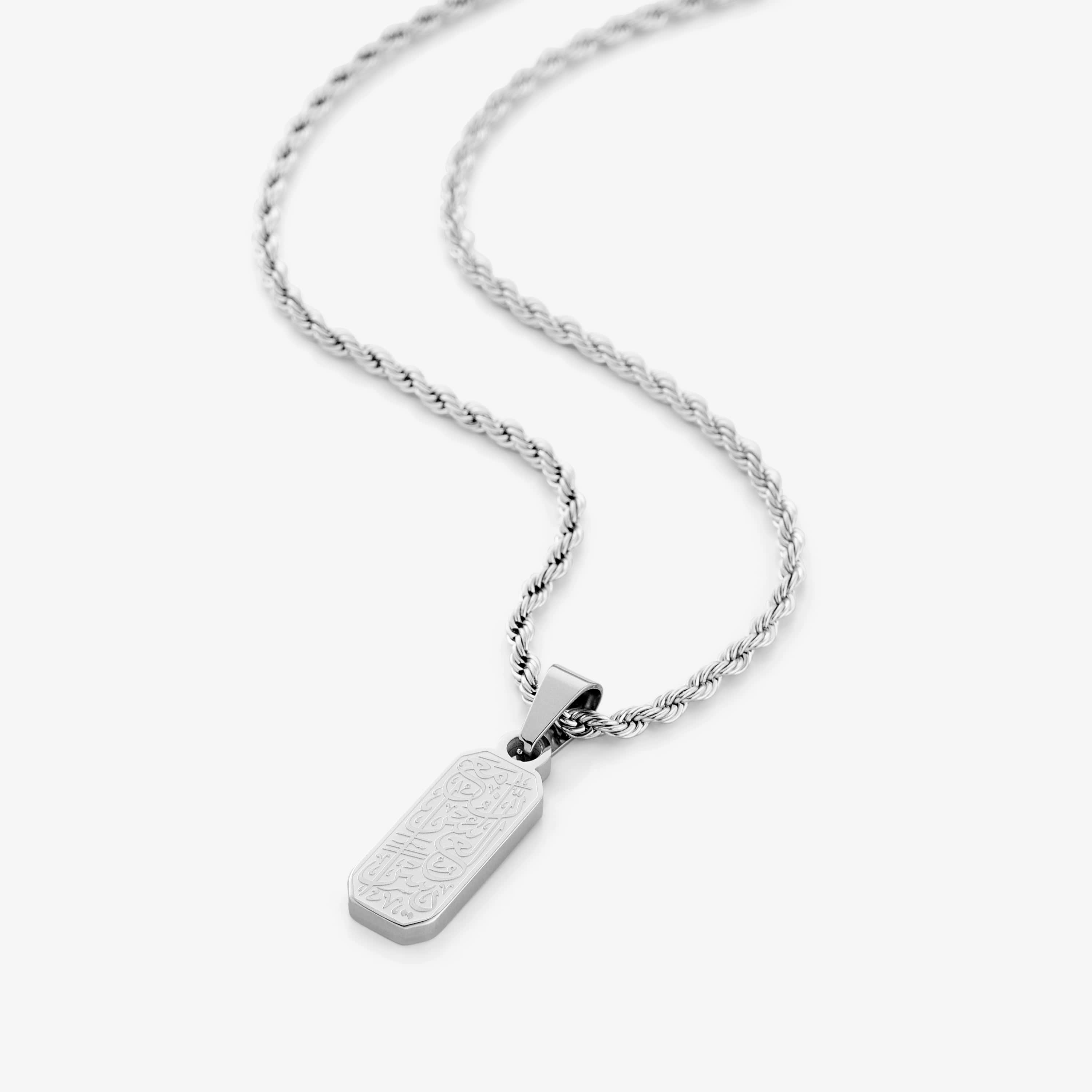 Close-up view of the engraved pendant showcasing its intricate design and message.