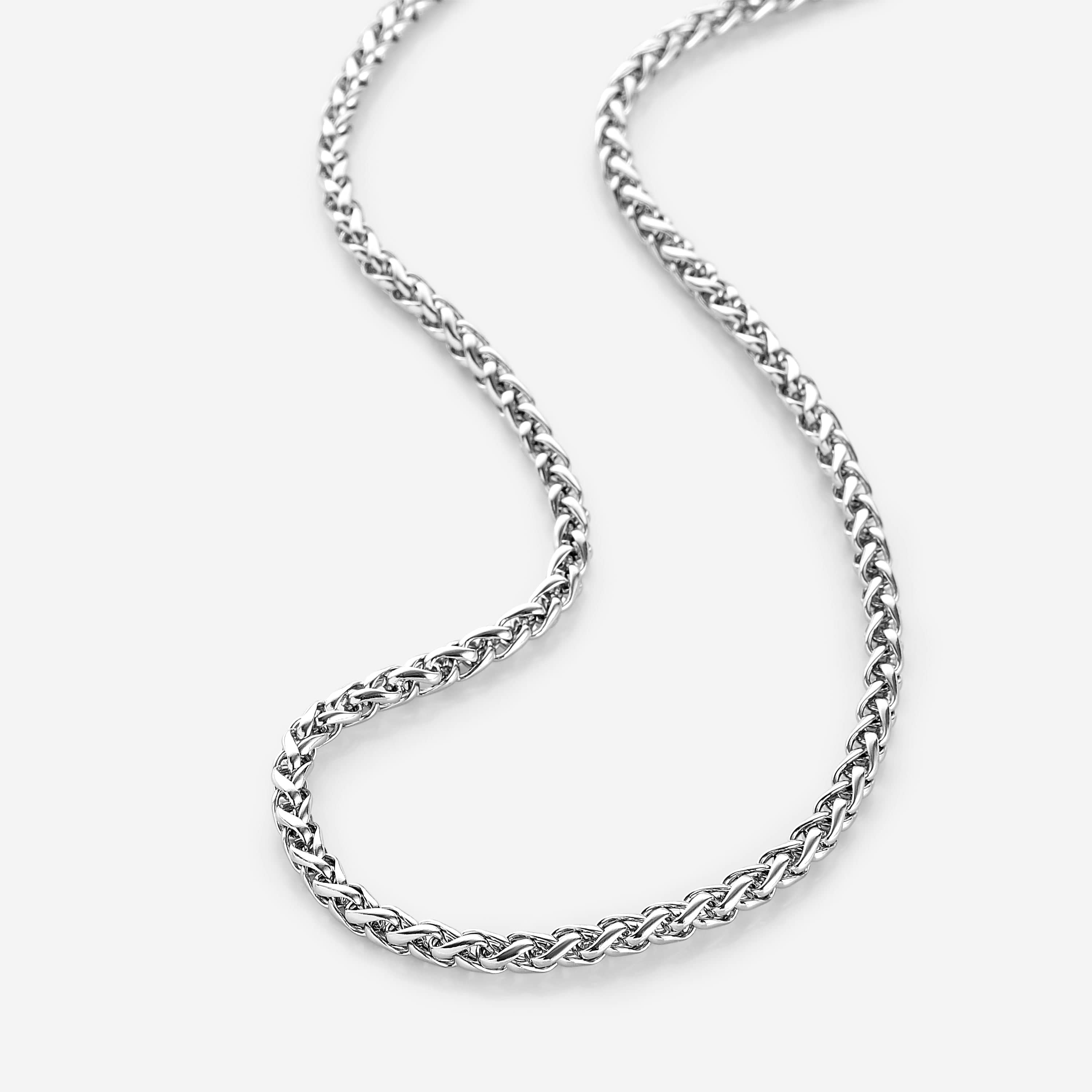 Close-up view of the bold wheat chain necklace showcasing its braided design.