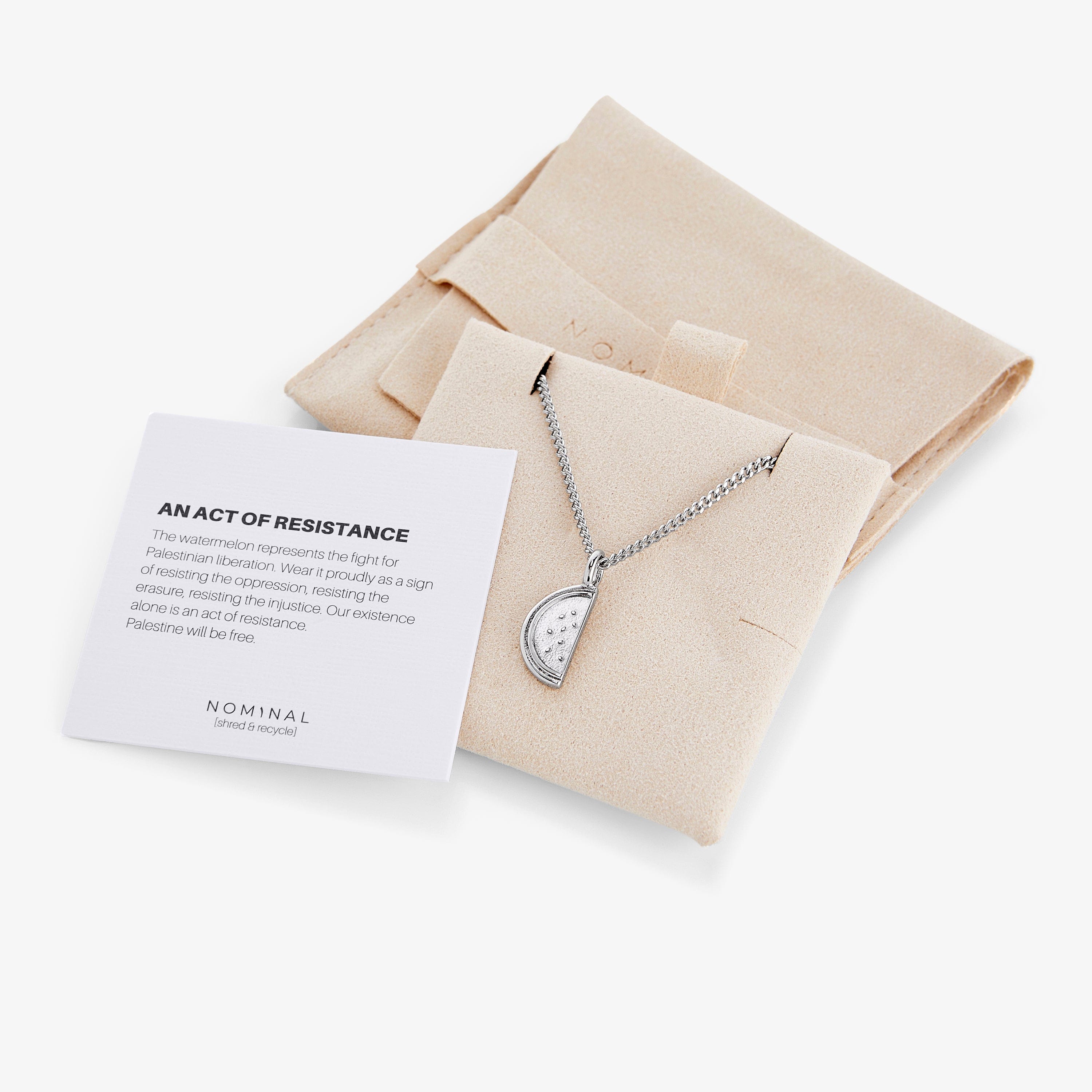 Display of the watermelon jewelry in a velvet pouch, emphasizing its gift-worthy packaging.