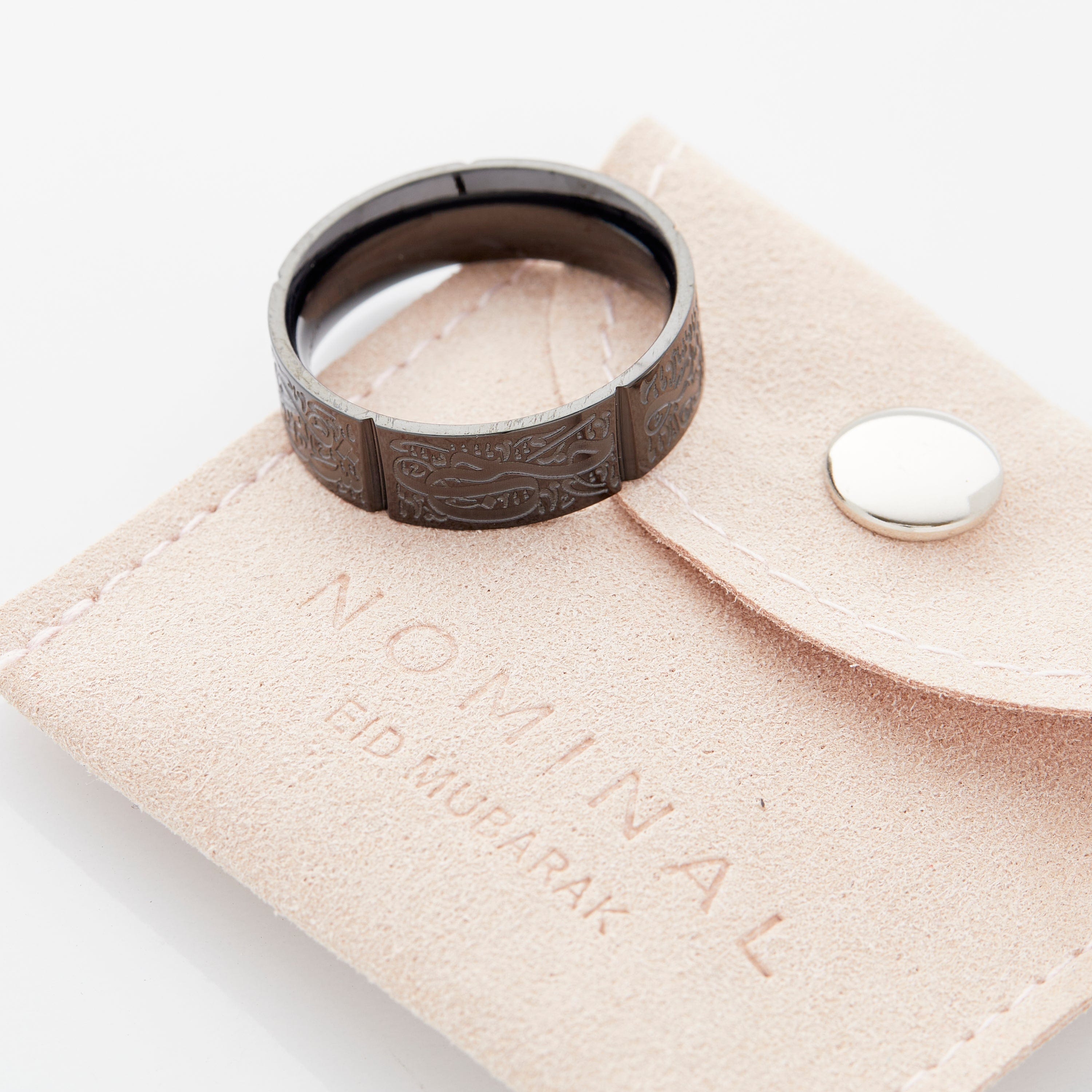 Close-up view of the Five Pillars Islamic Ring highlighting Arabic engravings.