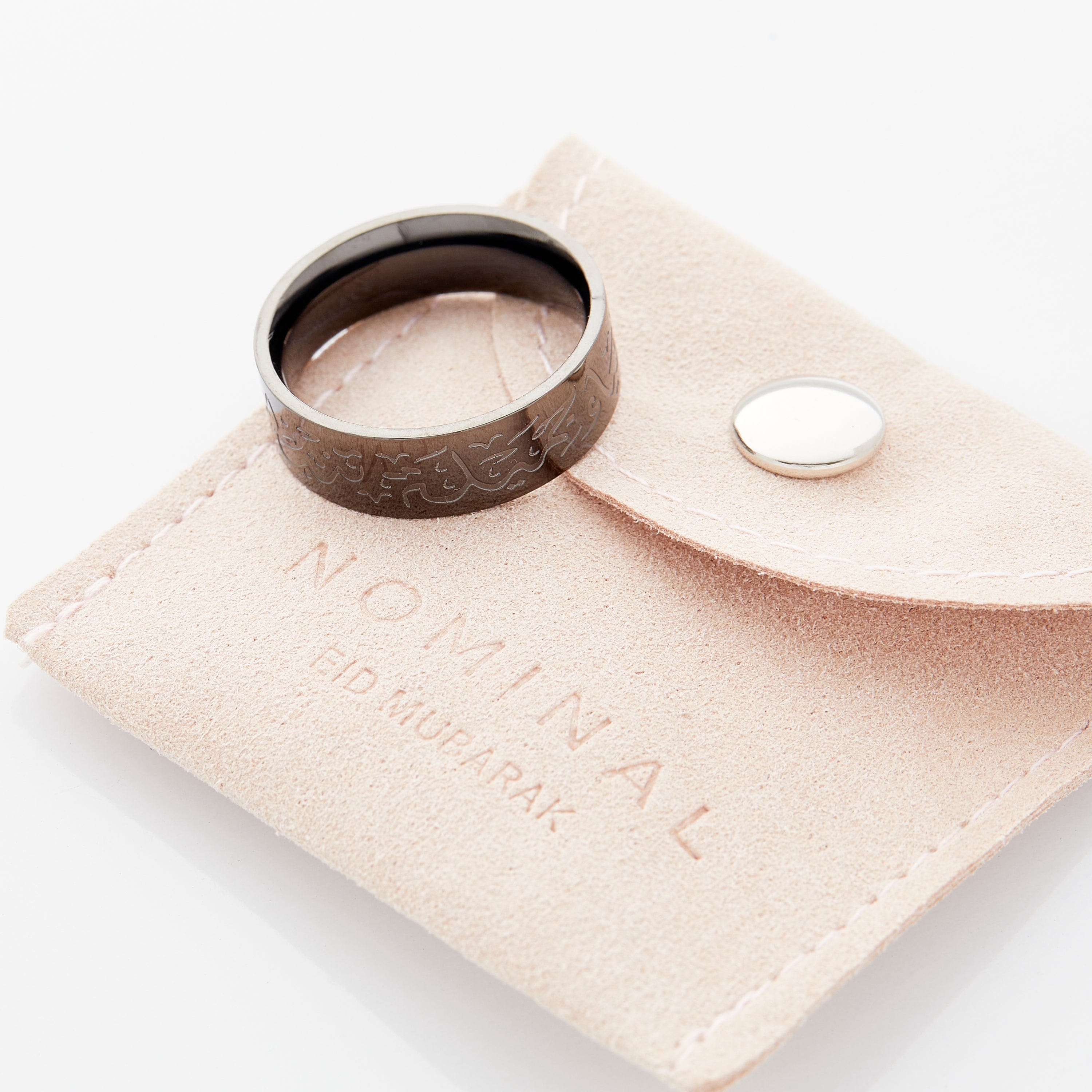 Patience Arabic calligraphy ring displayed on a hand, highlighting its stylish look for everyday wear.