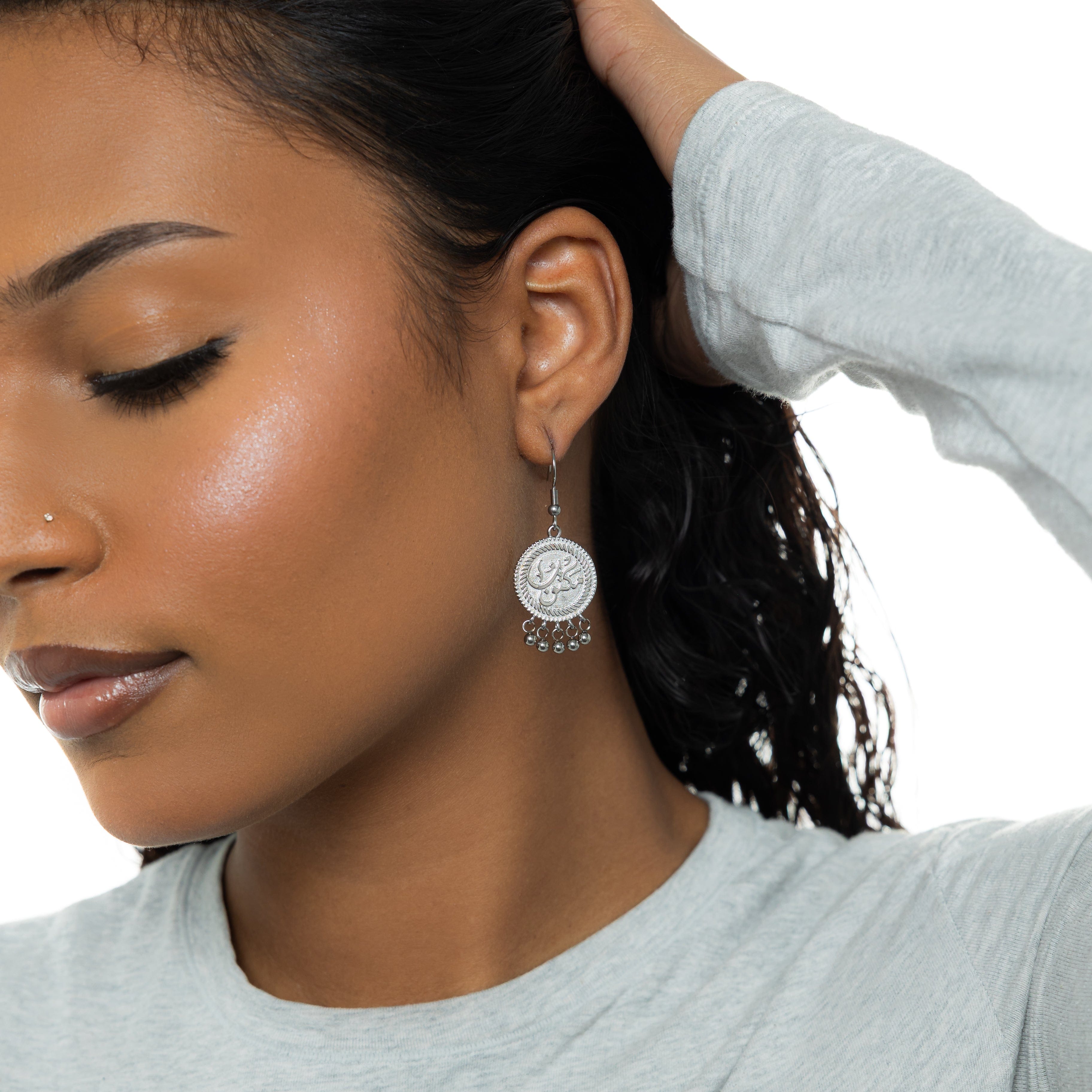 Elegant vintage coin earrings featuring delicate dangling orbs, perfect for sensitive skin.