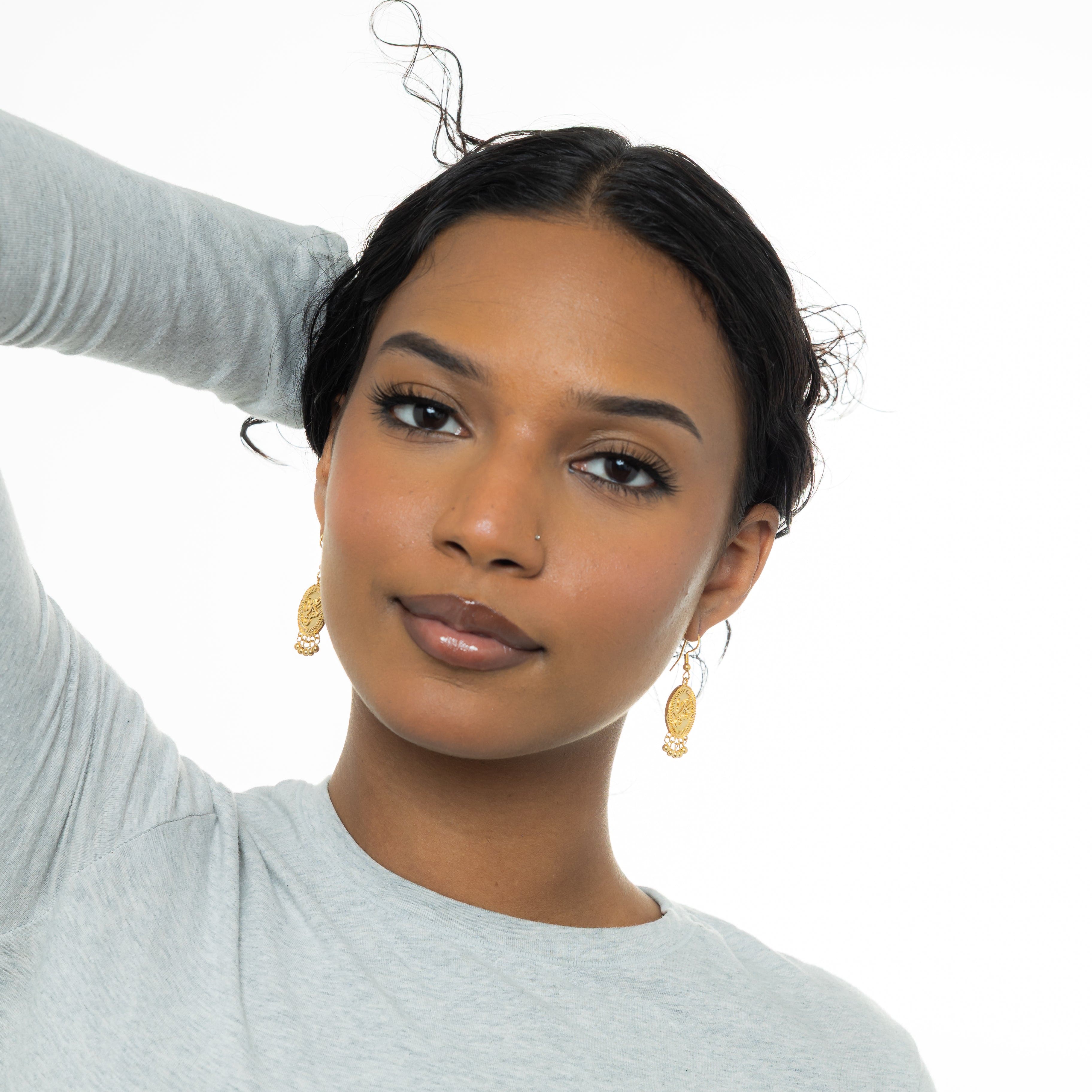 Elegant vintage coin earrings featuring delicate dangling orbs, perfect for sensitive skin.