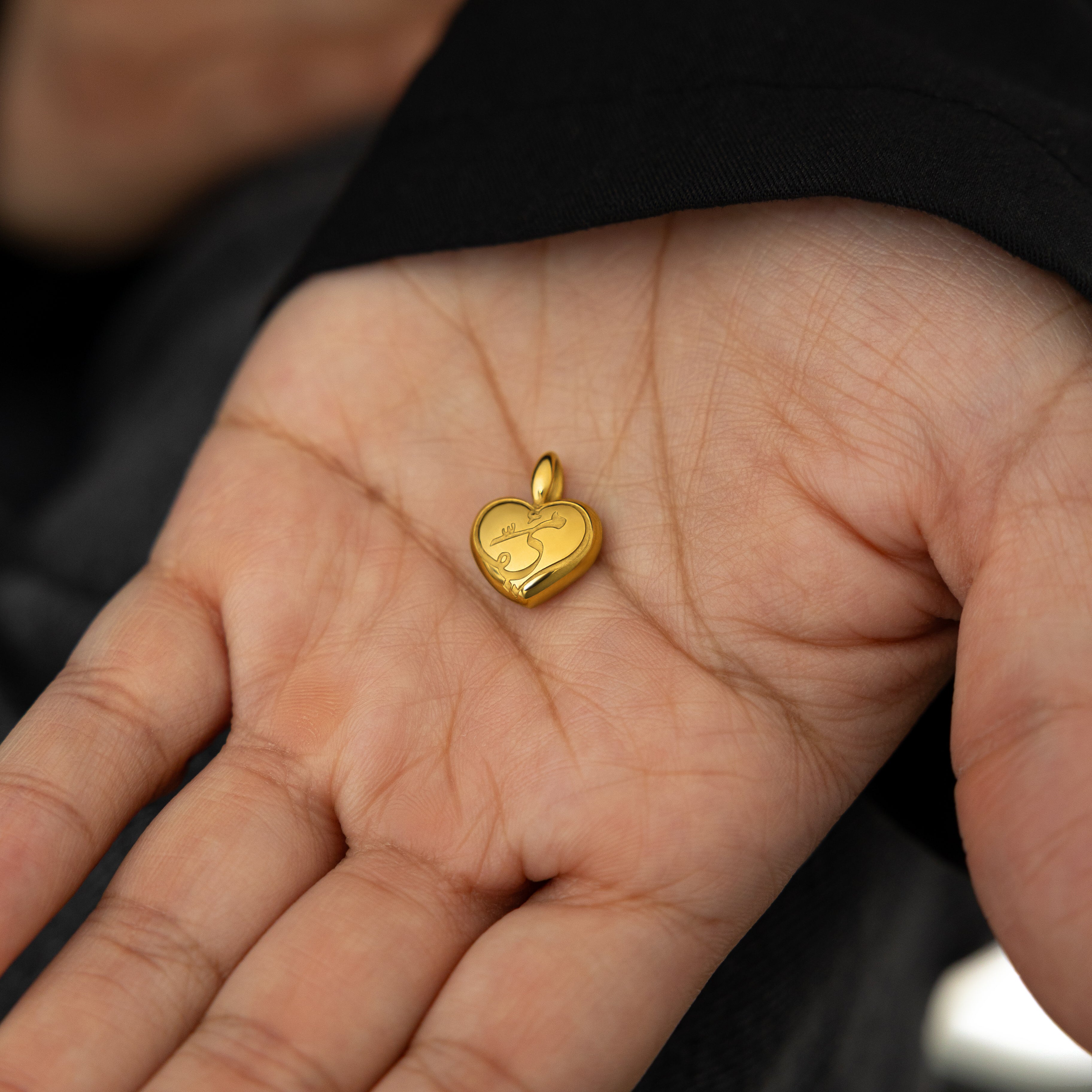Mamas Heart Charm displayed on a delicate chain, highlighting its elegance and versatility.