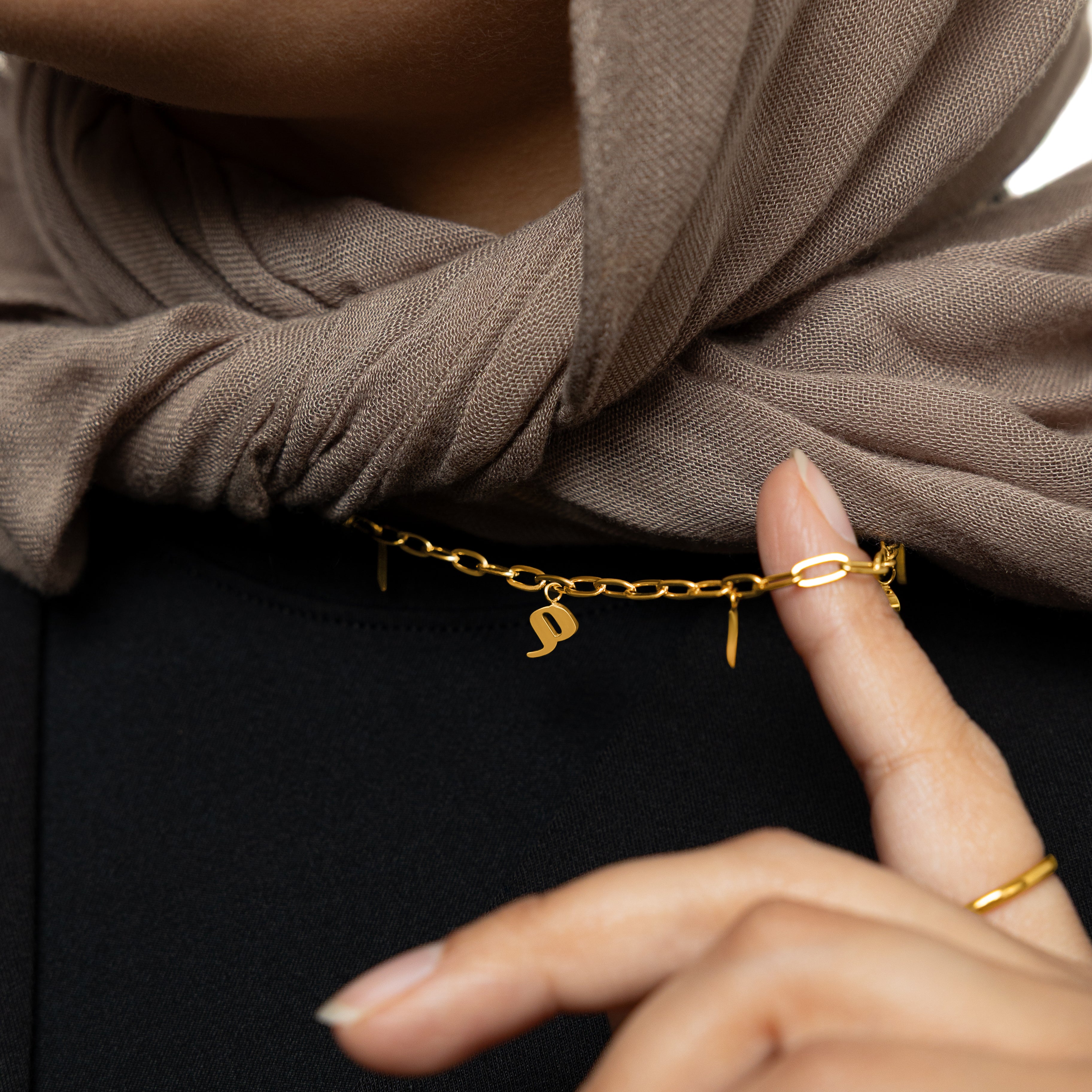 Mama charm necklace displayed in a velvet pouch, perfect for gifting to new mothers.