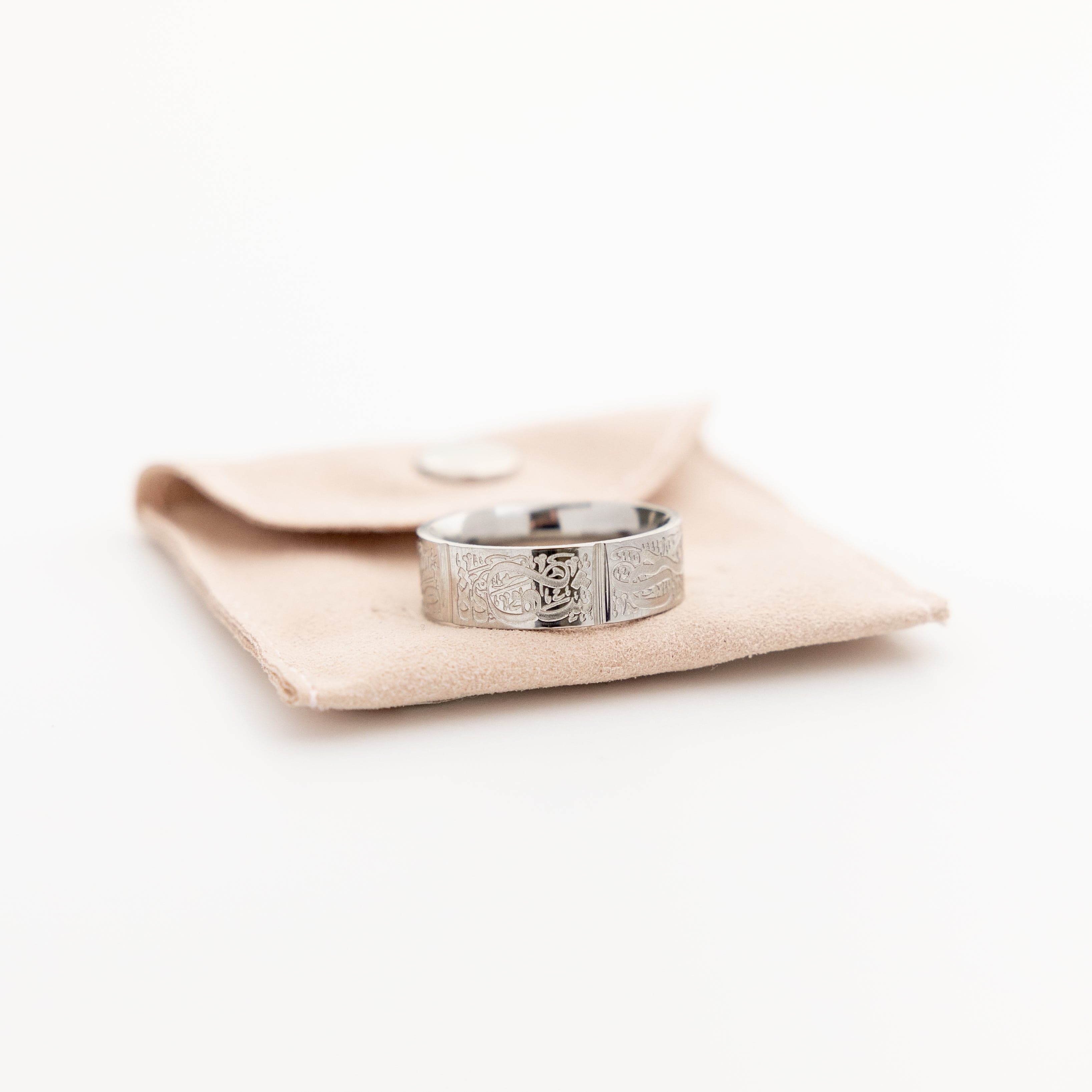 Five Pillars Islamic Ring displayed in a velvet pouch, emphasizing its premium quality.