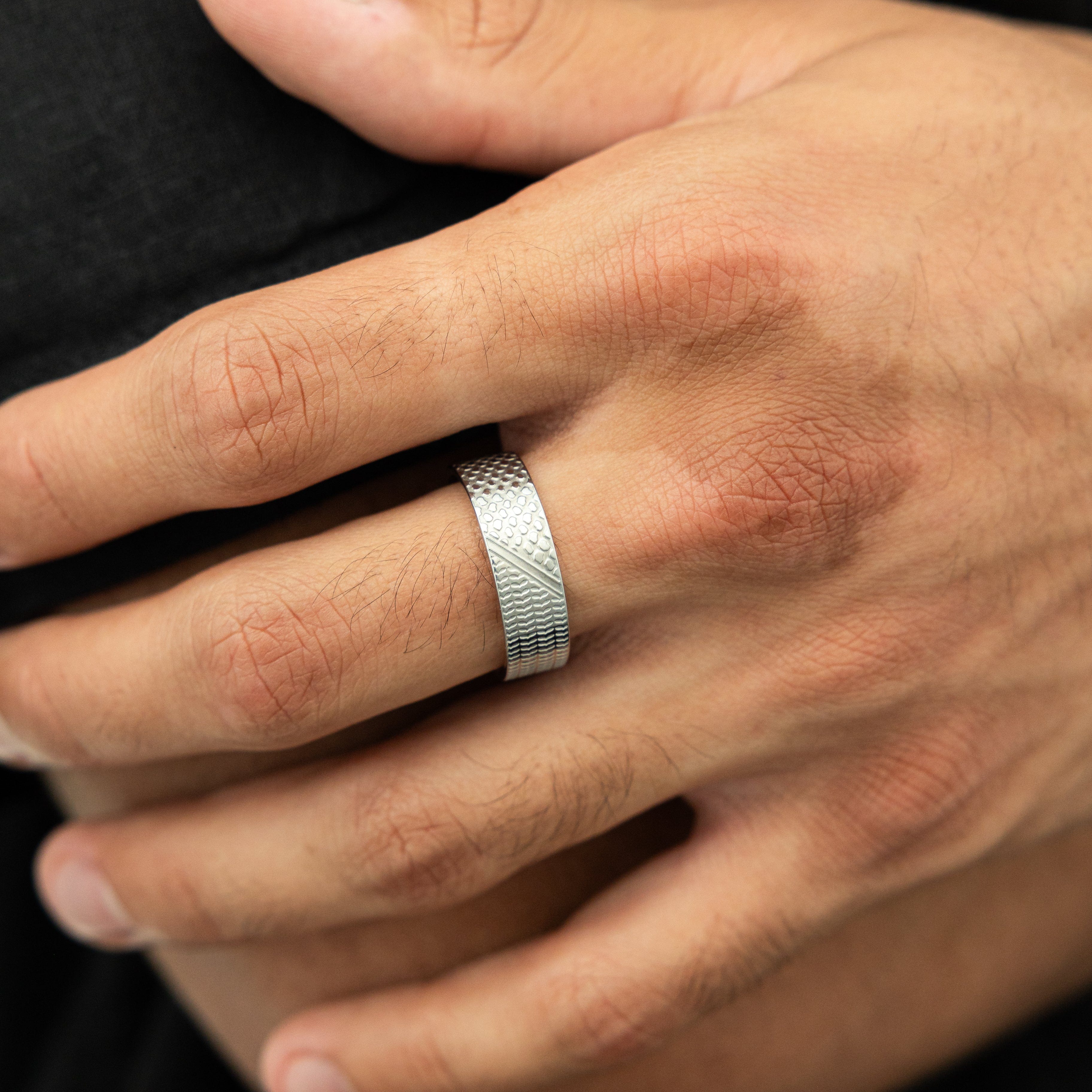 Close-up of the keffiyeh ring featuring the olive leaf pattern, symbolizing Palestinian culture.