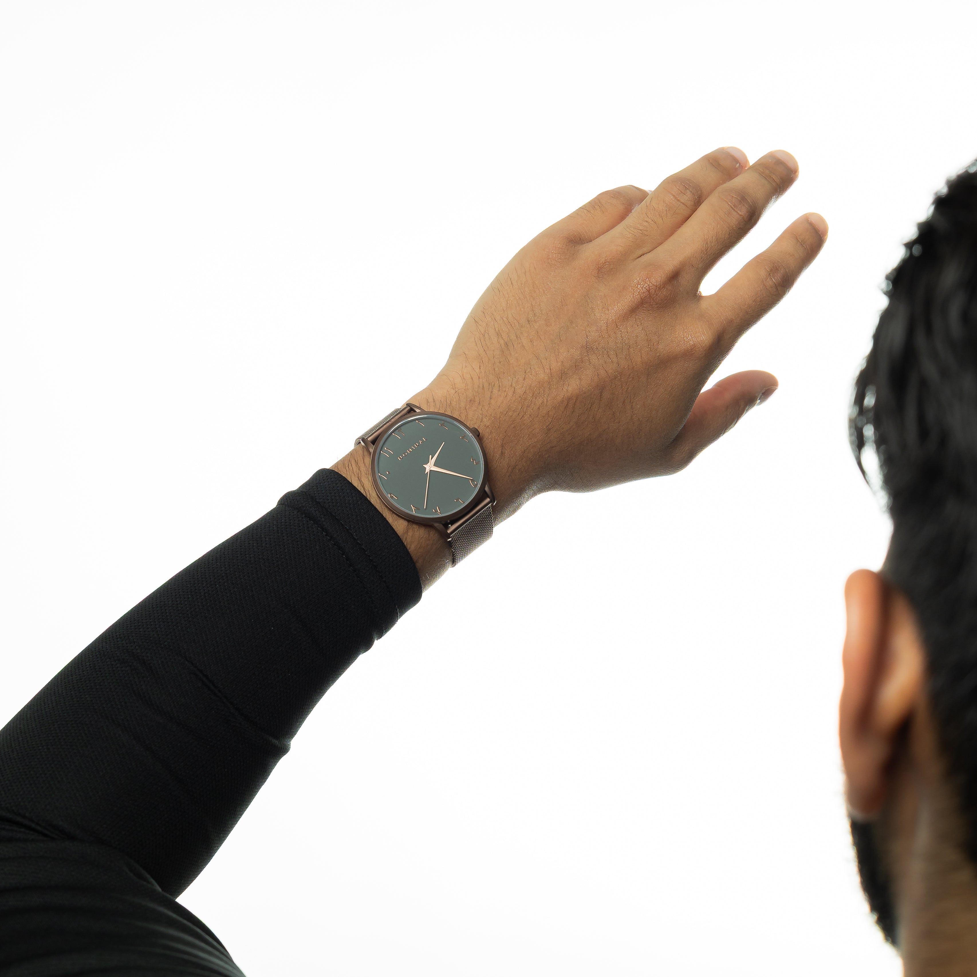 Close-up of the Nominal Outcast luxury watch featuring a grey and bronze dial with sapphire crystal.