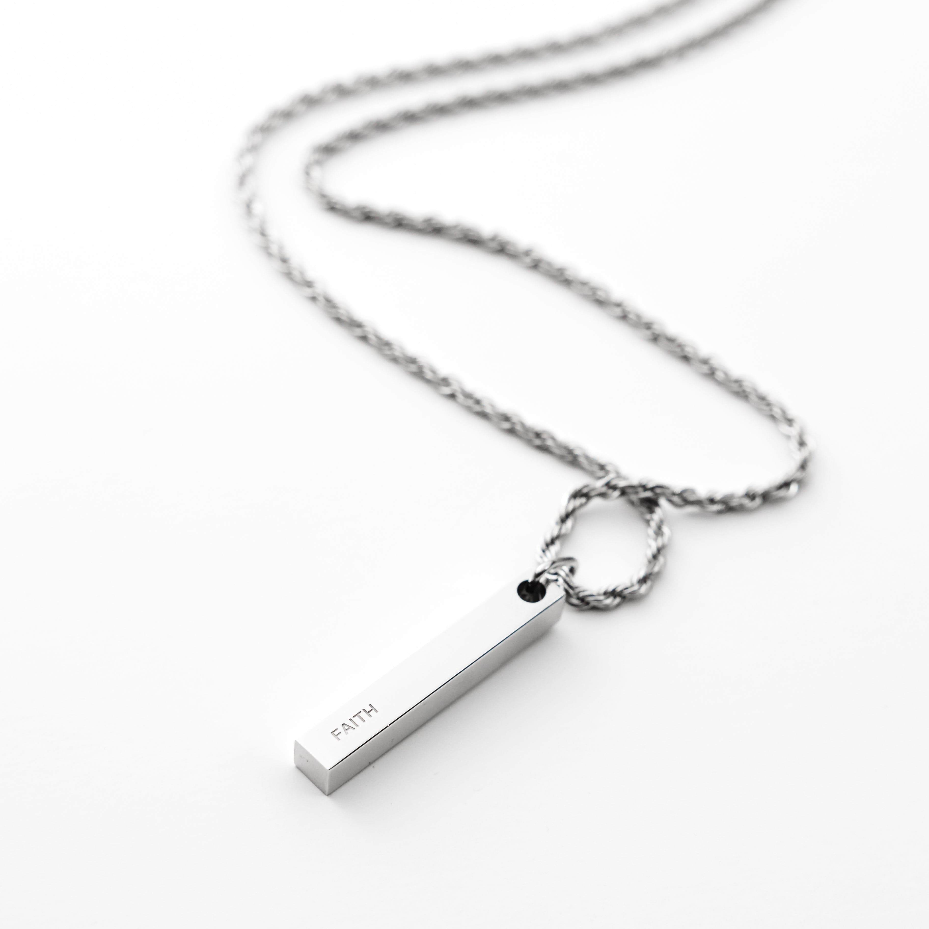 Mens faith necklace with warranty showcased in a velvet pouch.