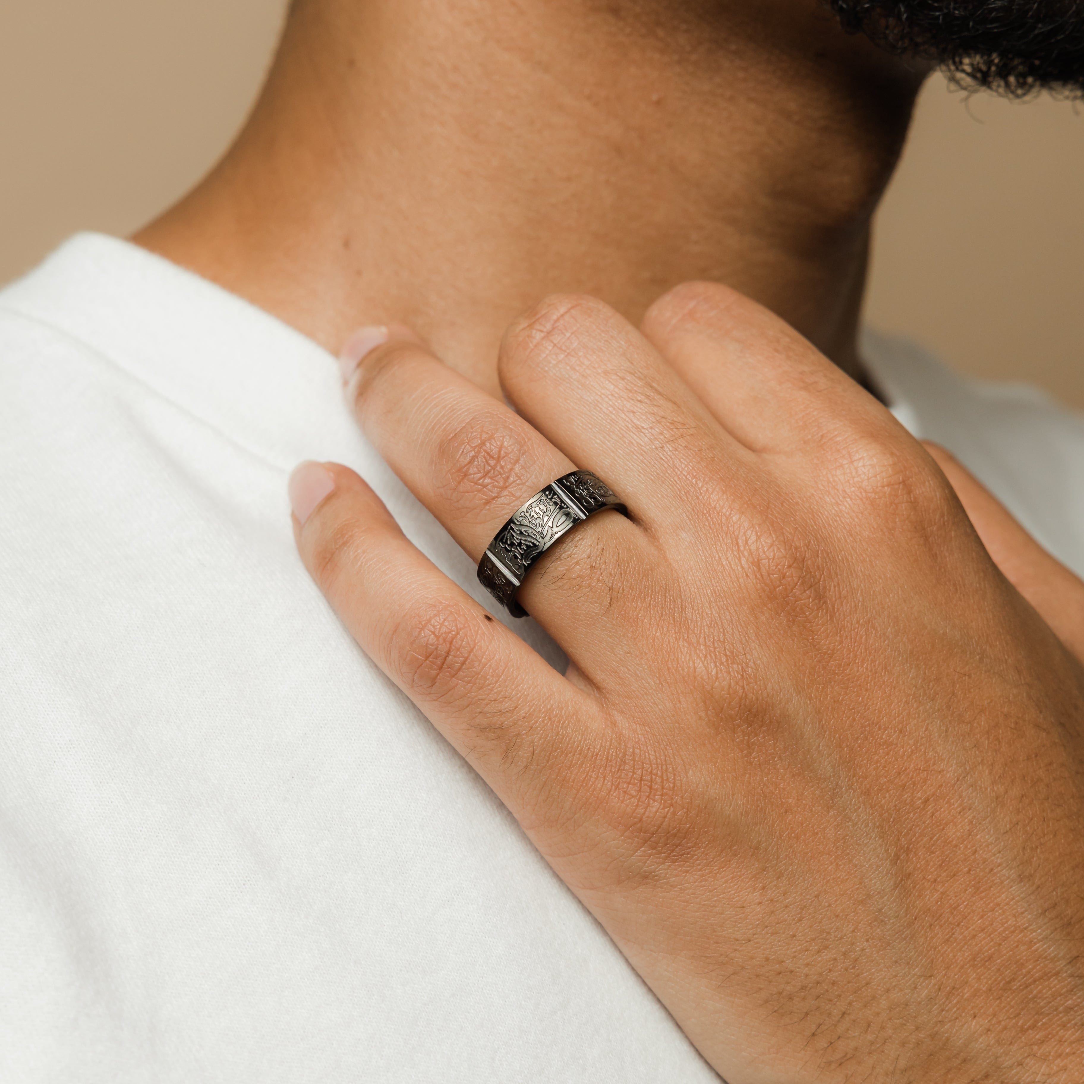 Man wearing the Five Pillars Islamic Ring, showcasing its elegant design.