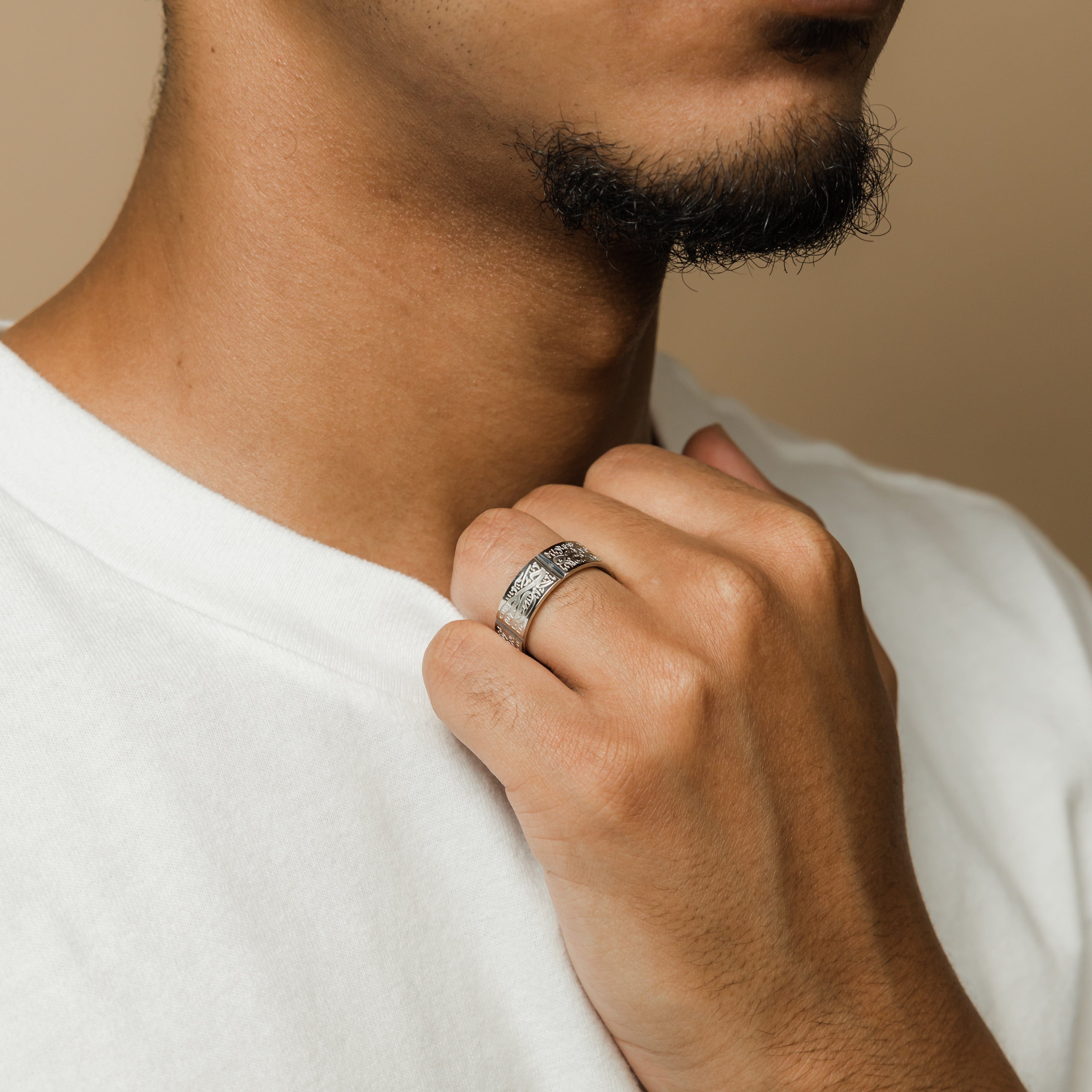 Close-up view of the Five Pillars Islamic Ring highlighting Arabic engravings.