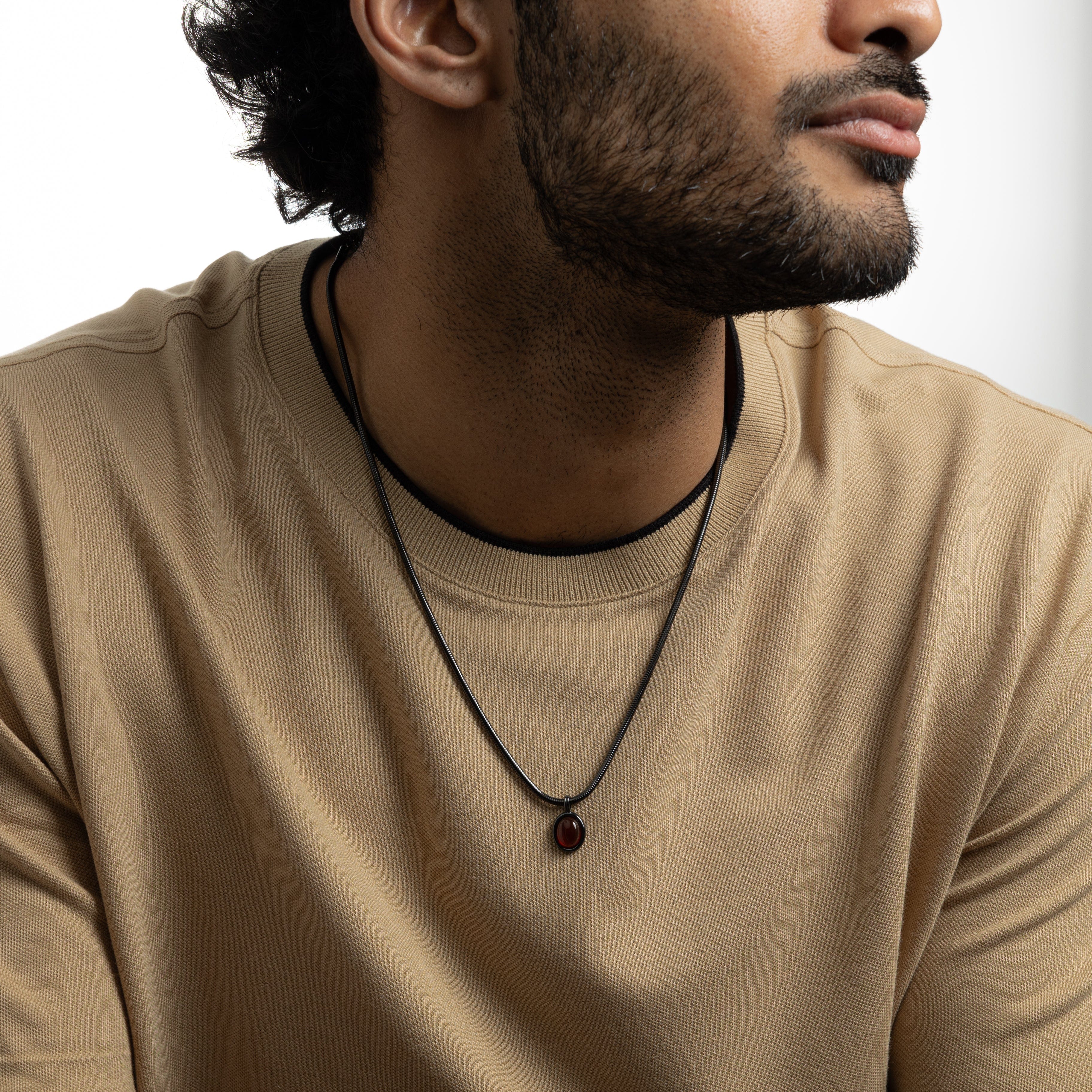 Men wearing the stylish red agate necklace during a casual outing, illustrating its versatility.