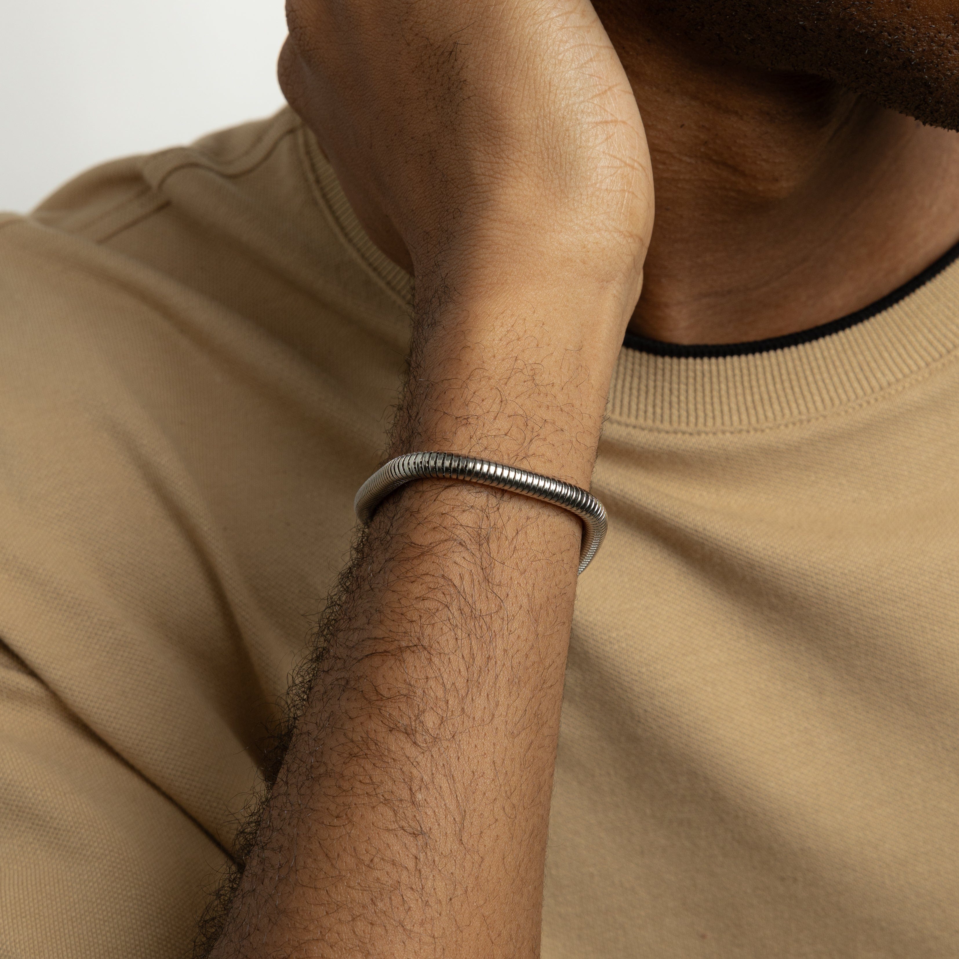 Close-up of the Harmony stainless steel bracelet showcasing its sleek, uniform links, perfect for fashion-conscious men.