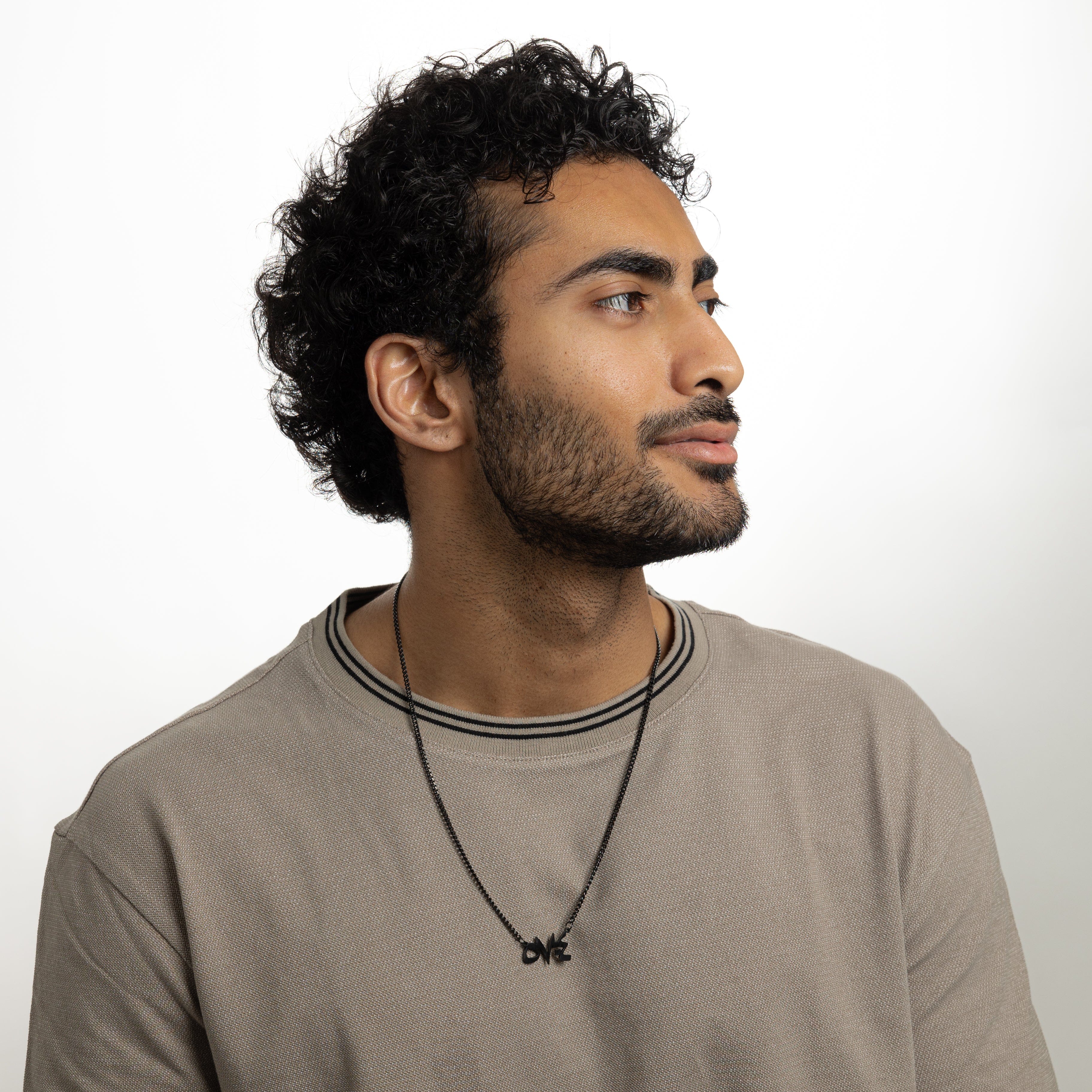 Velvet pouch containing the best stainless steel religious necklace, perfect for gifting.