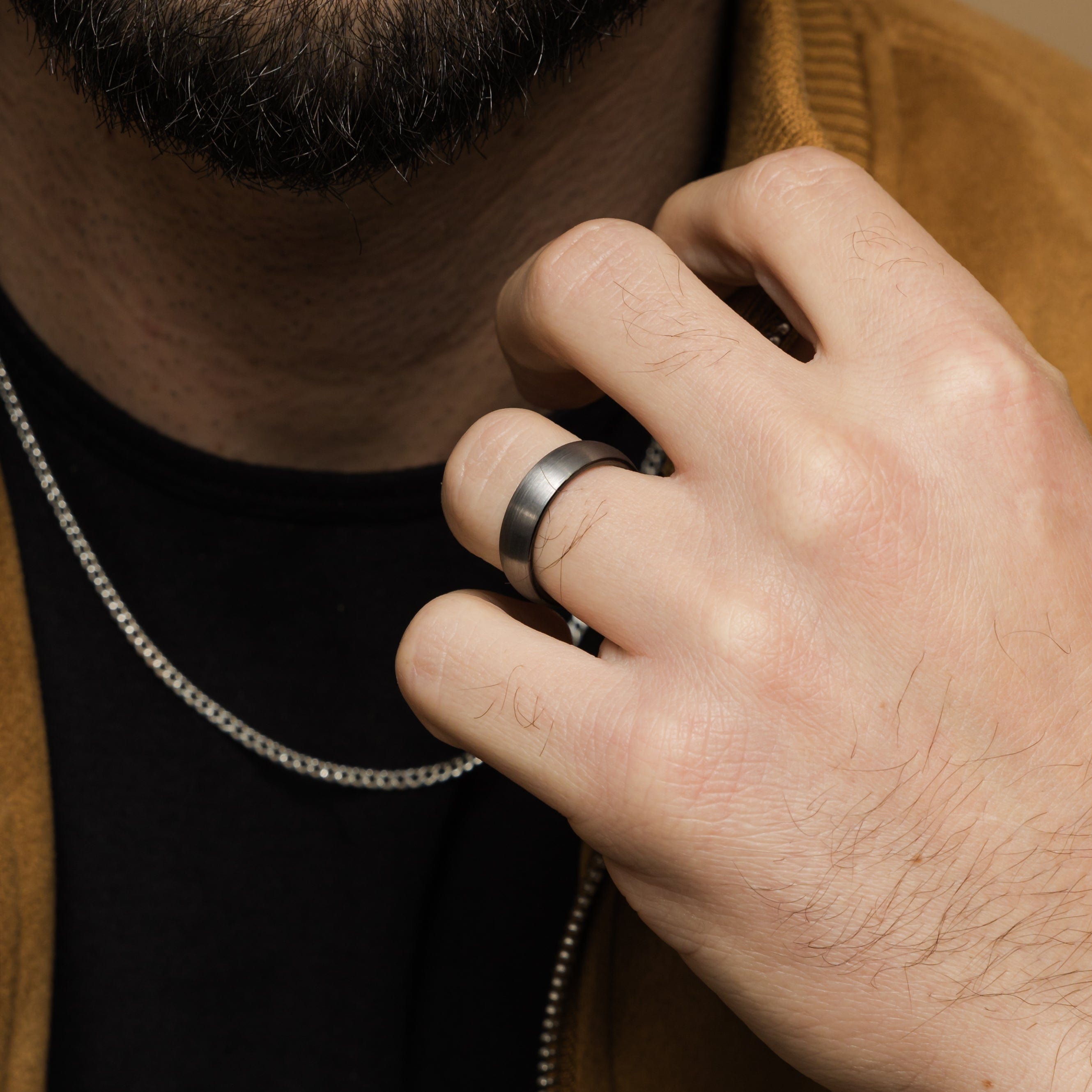 Close-up of the brushed tungsten band highlighting its smooth interior for comfort.