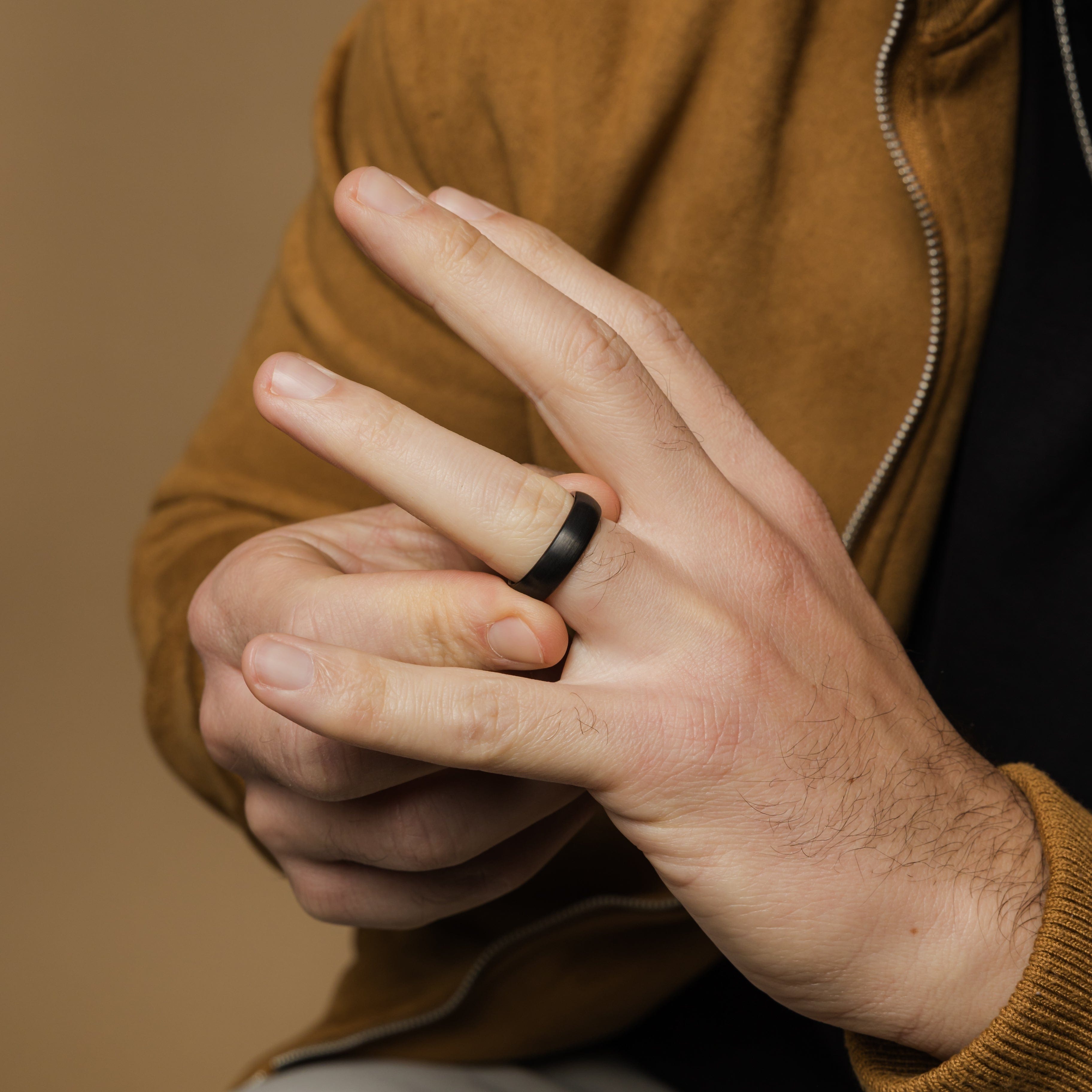 Brushed tungsten wedding band in silver, showcasing its elegant finish from a side angle.