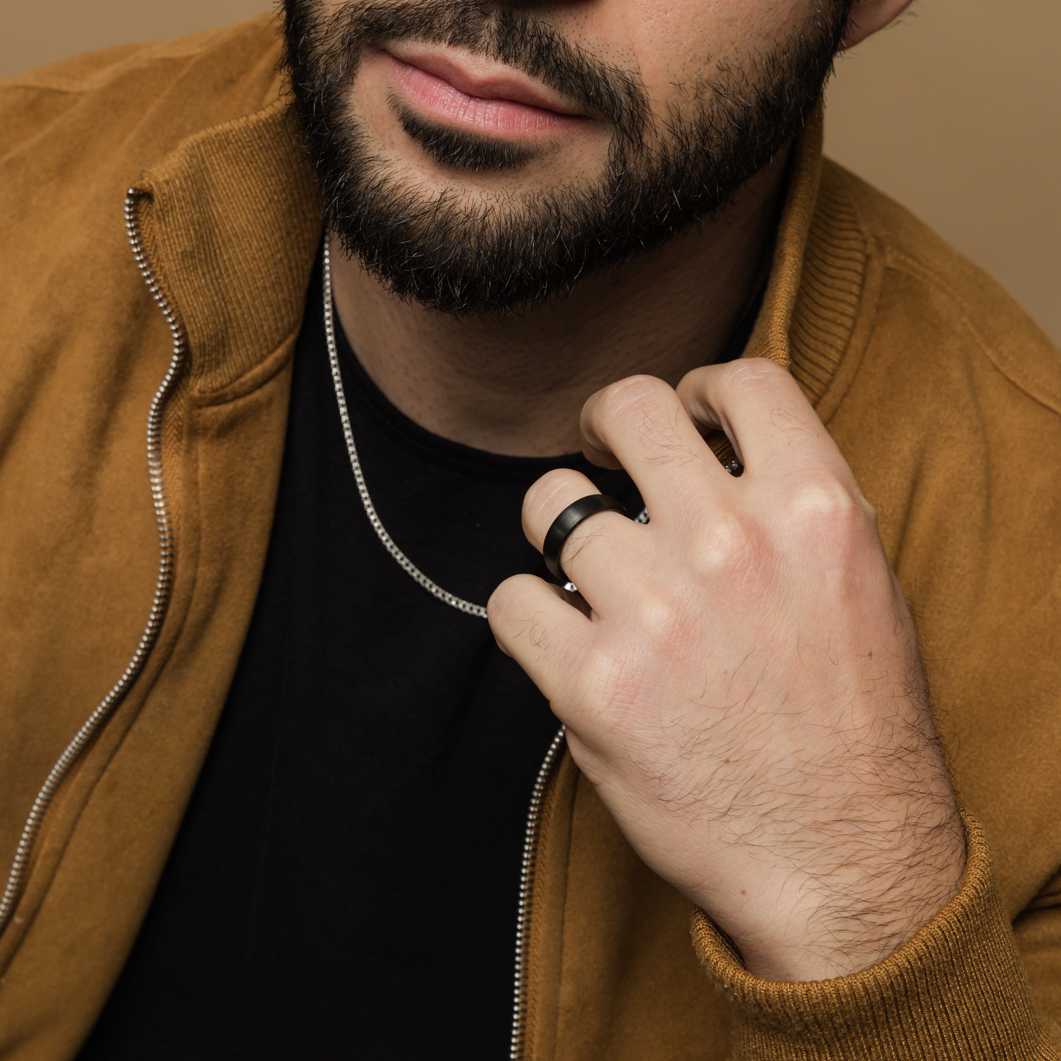 Close-up of the brushed tungsten band highlighting its smooth interior for comfort.