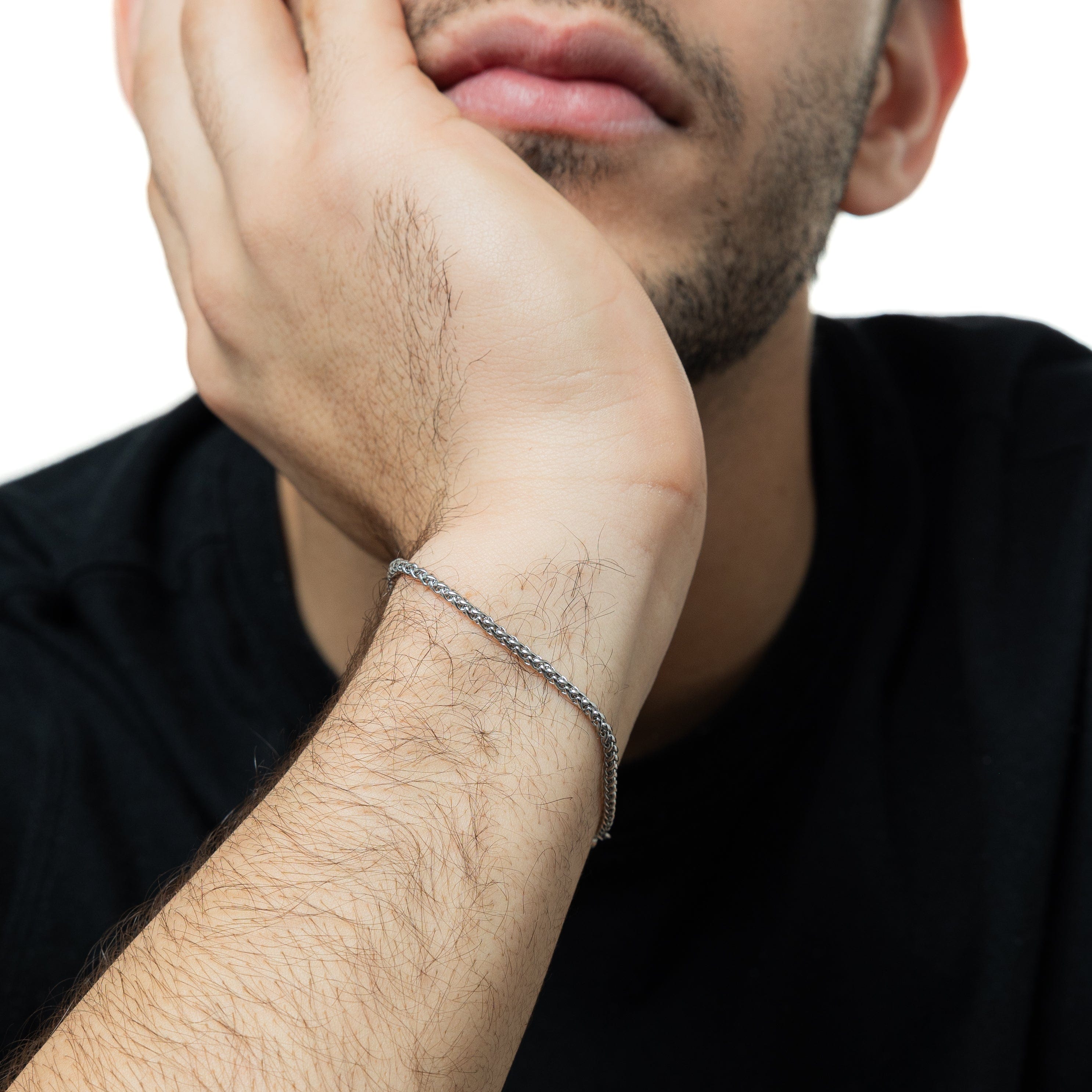 Close-up of the sleek micro wheat chain bracelet highlighting its 2MM thickness.