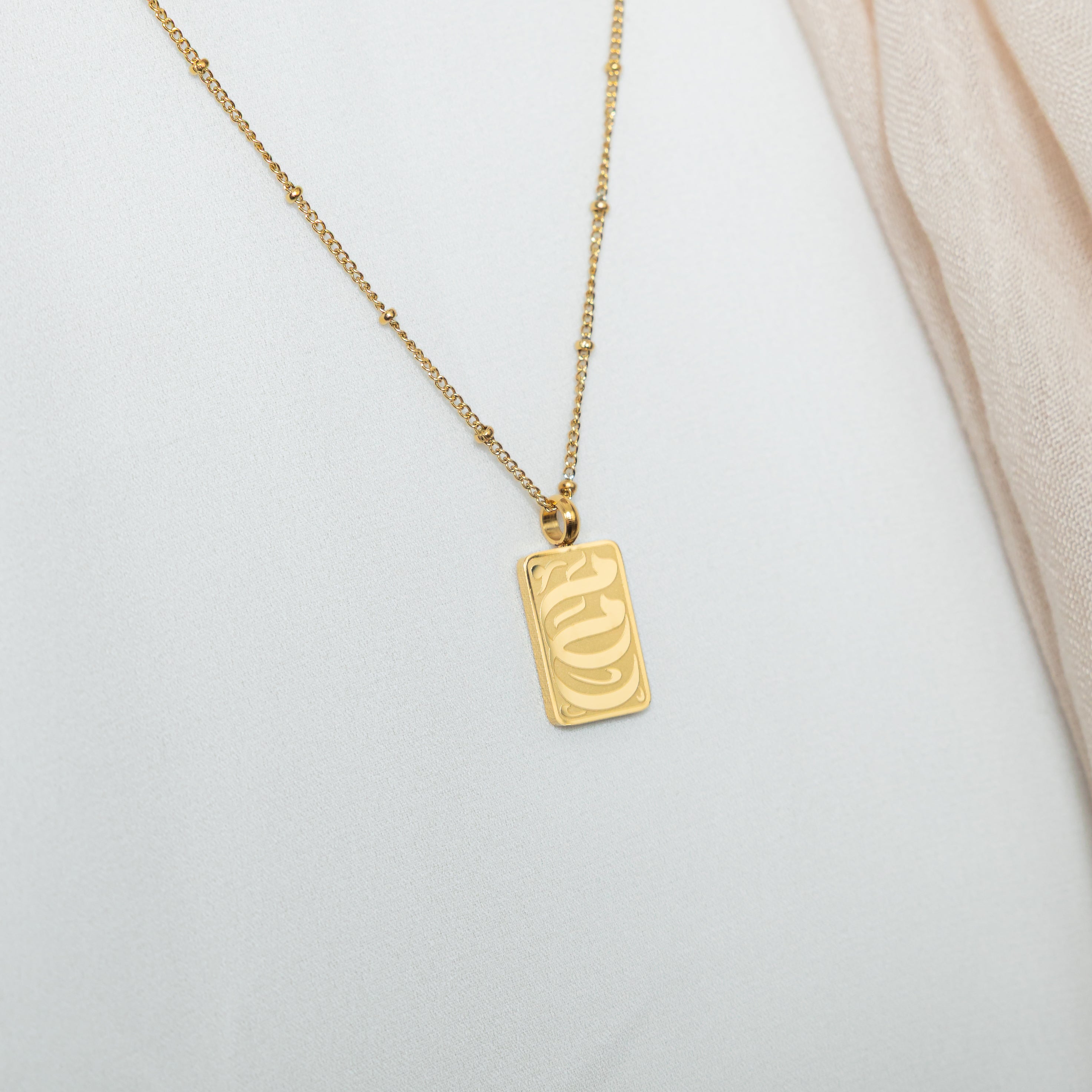 The necklace elegantly displayed in a velvet pouch, ready for gifting.