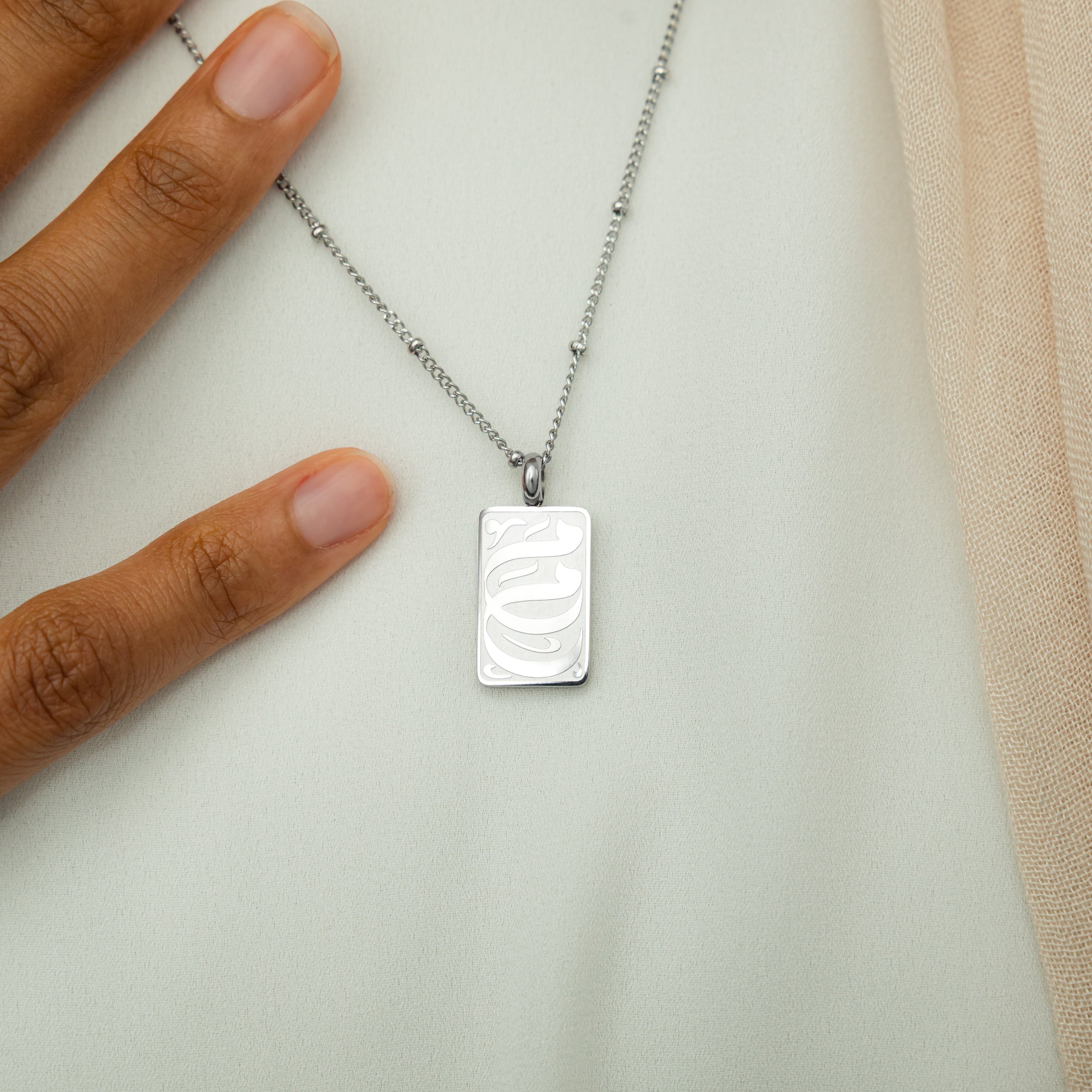 The necklace elegantly displayed in a velvet pouch, ready for gifting.